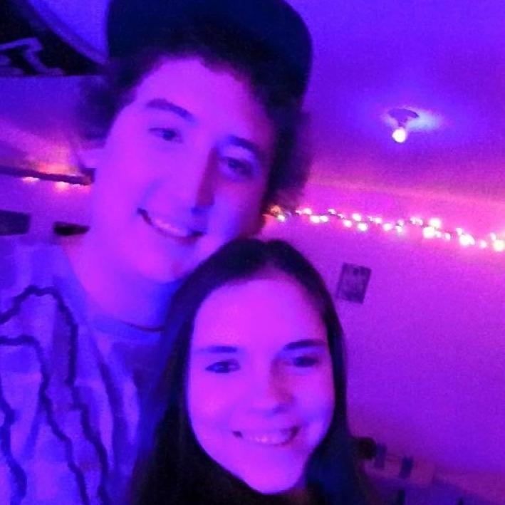 The Beginning!
This is one of our first photos together when we first started dating. The purple lights are my favorite lol.