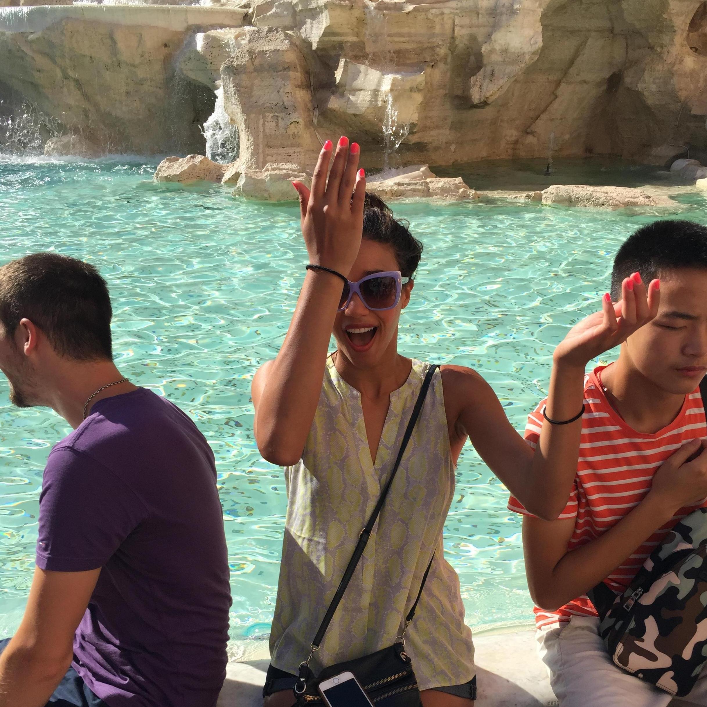 Alex making a wish at the Trevi Fountain