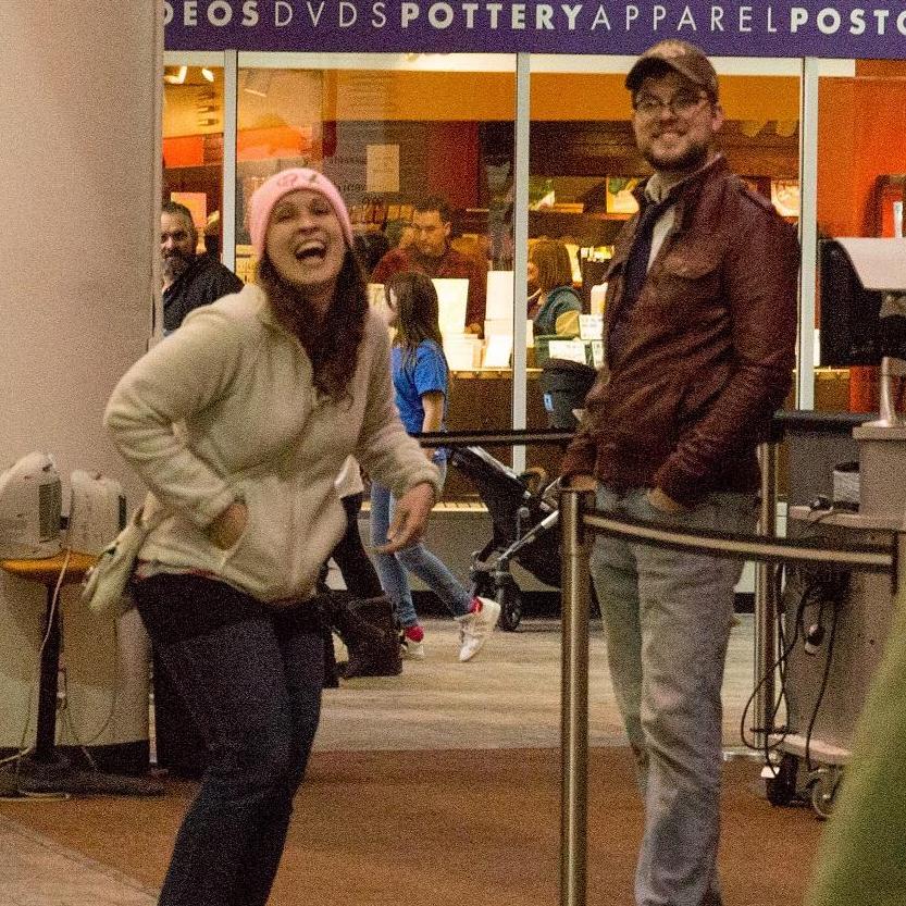 Monica's first reaction when she saw everyone at the museum during the proposal.
