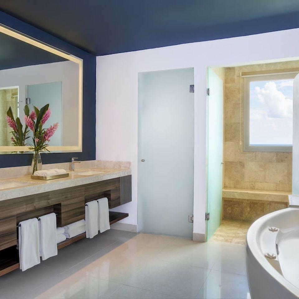 Rainfall showers and spa tubs in all suites with Lavish toiletries, bathrobes and slippers in select rooms