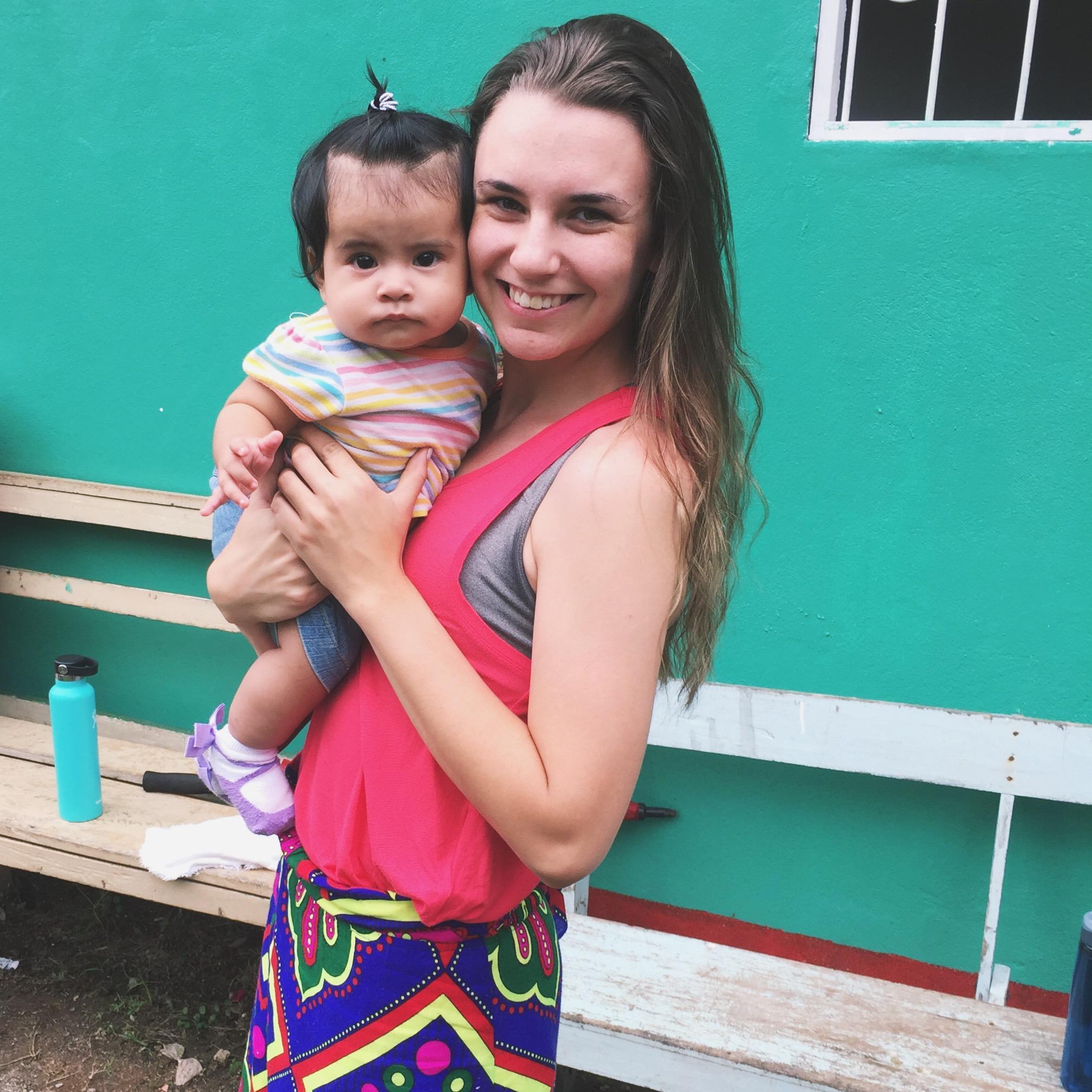 Jojo in Nicaragua doing what she loves, cuddling babies!