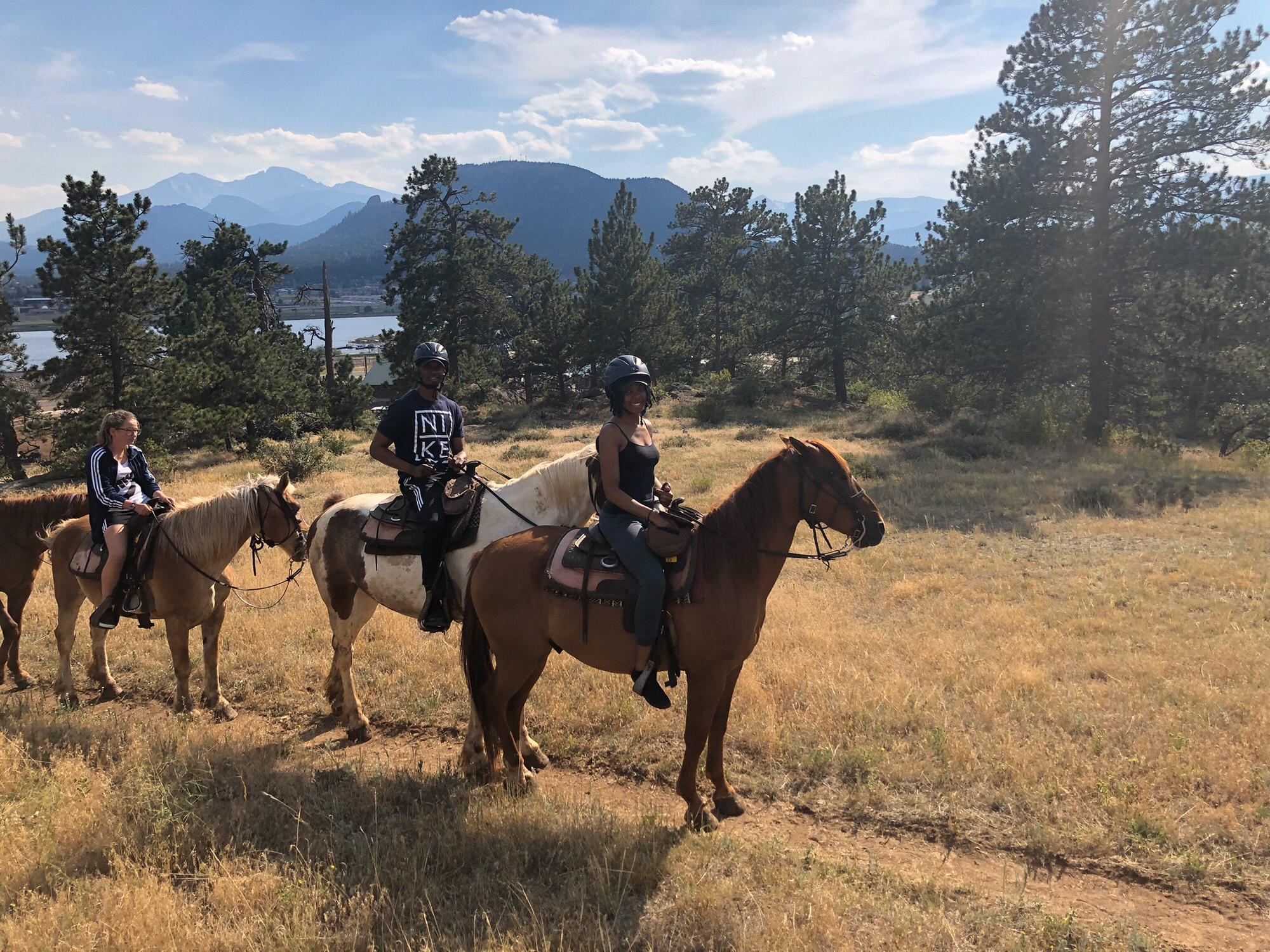 Horseback riding through the mountains of Colorado together.