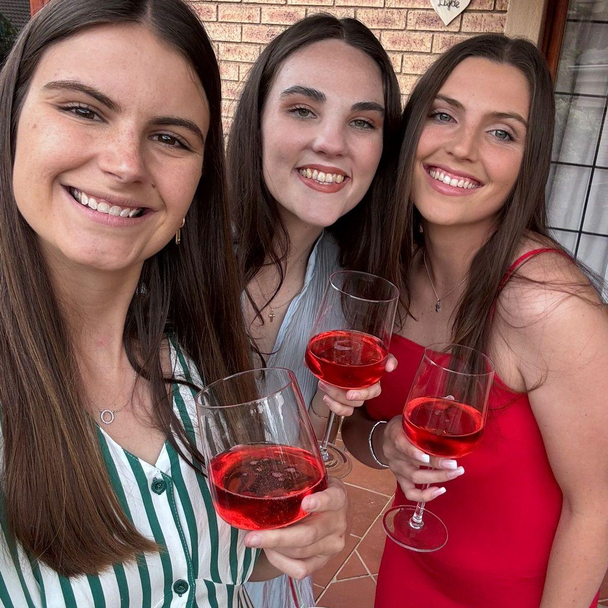 The girls trying to distract Megan from the engagement.