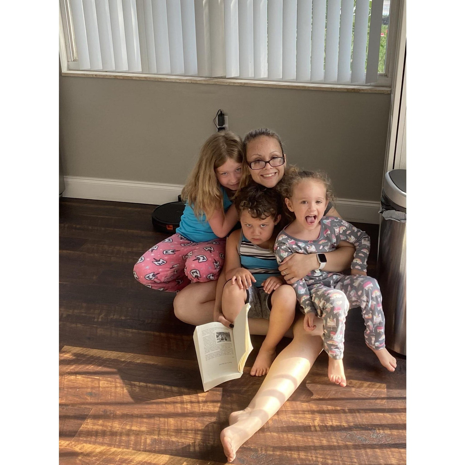 Early morning coffee and story time on Aunt Gina's kitchen floor.