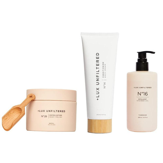 + Lux Unfiltered Supreme Shower Kit with N°14 Conditioning Body Cream in Santal, N°16 Opulent Shower Oil in Tuberose, and N°28 Exfoliating Body Polish in Santal