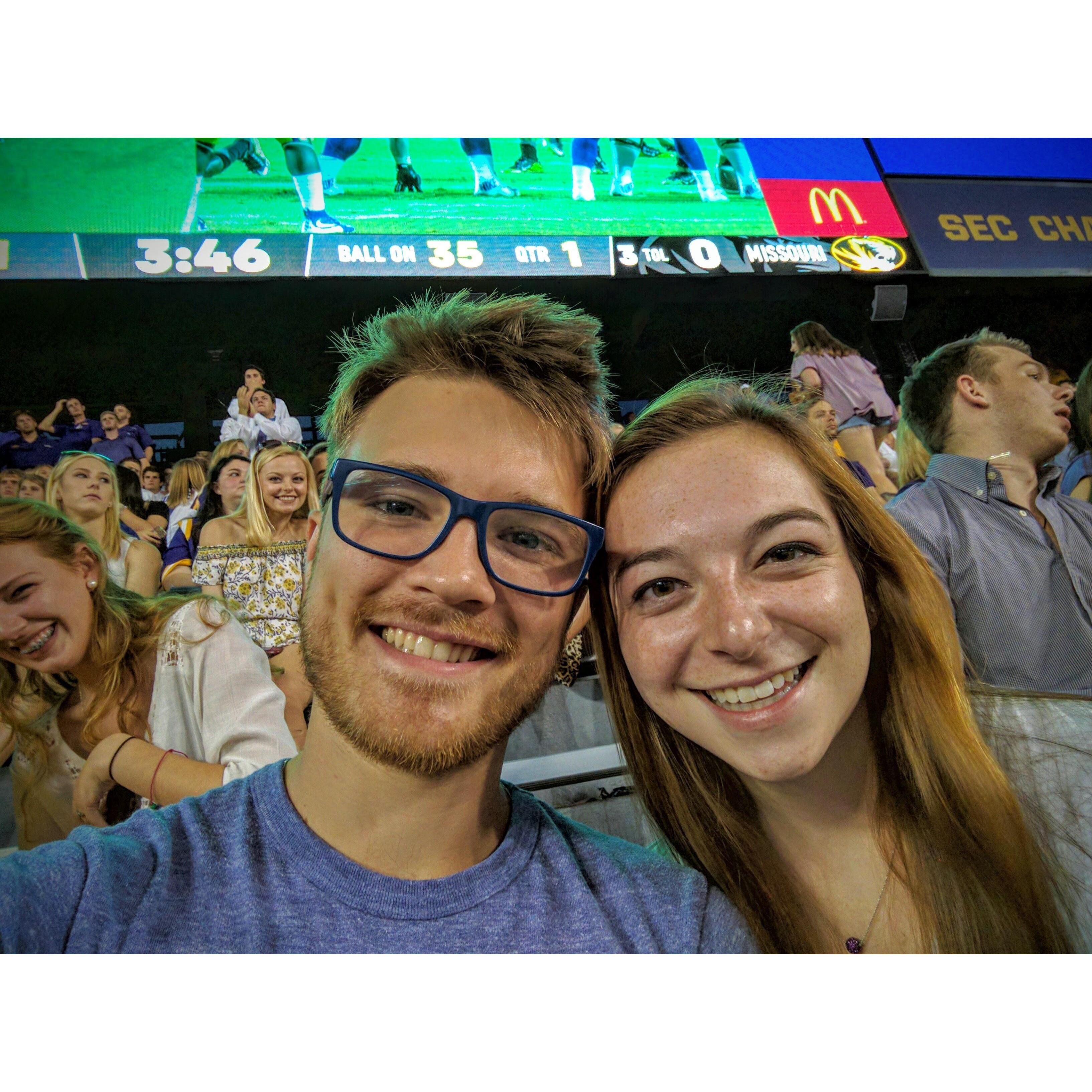 Neither one of us are big sports fans, but every LSU student is obligated to attend football games.