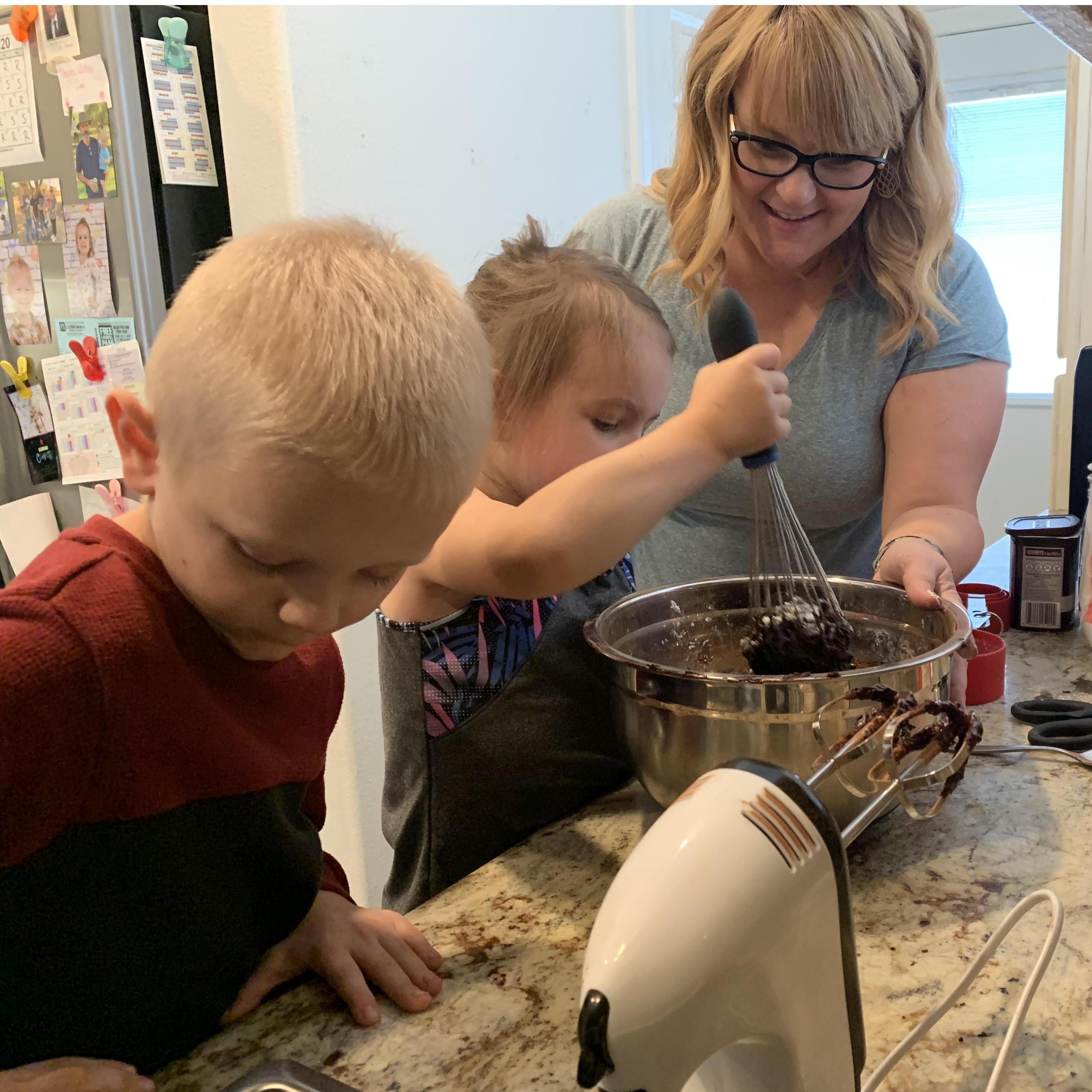 The kids helped Tanya bake a cake for Daddy's birthday. They love helping in the kitchen, and always want to know what Tanya is cooking in there!