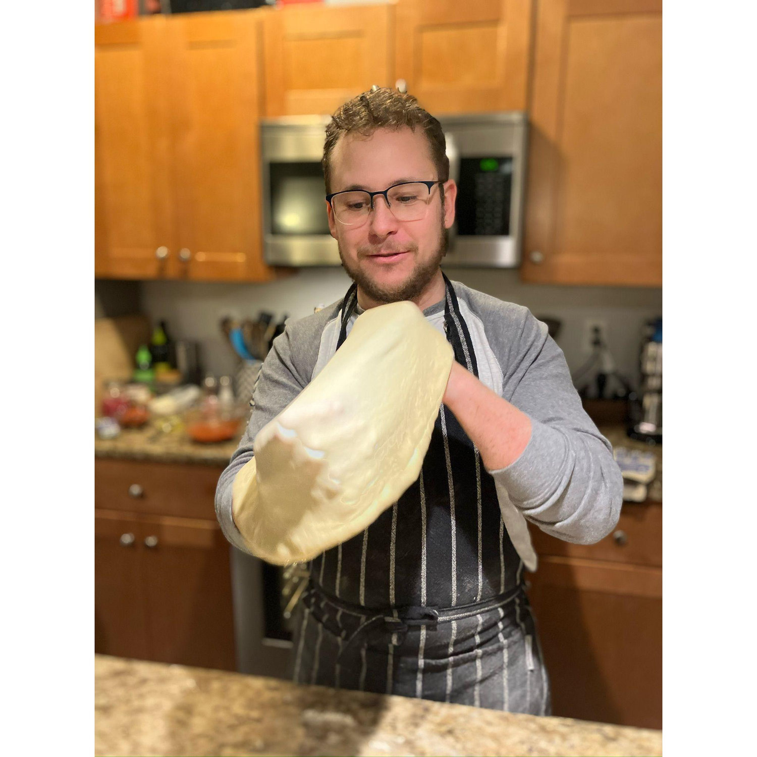 Tommy making pizza for New Year's Eve. December 2023