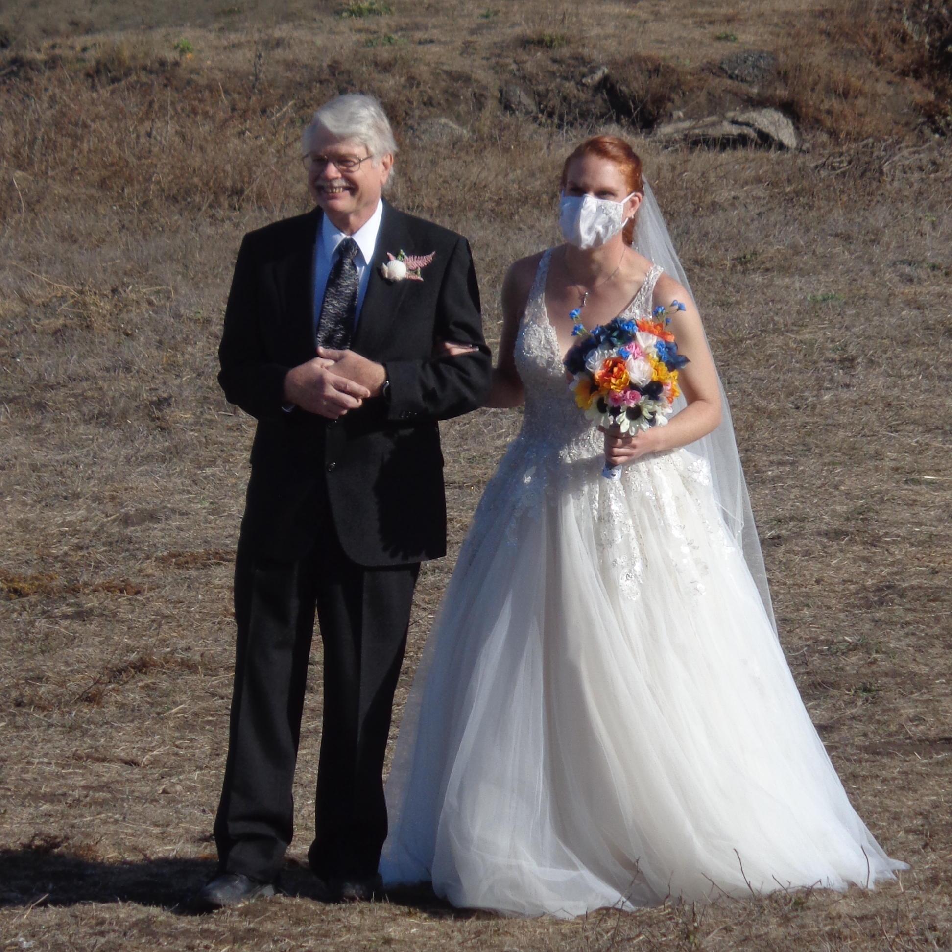 My dad walking me into the ceremony.