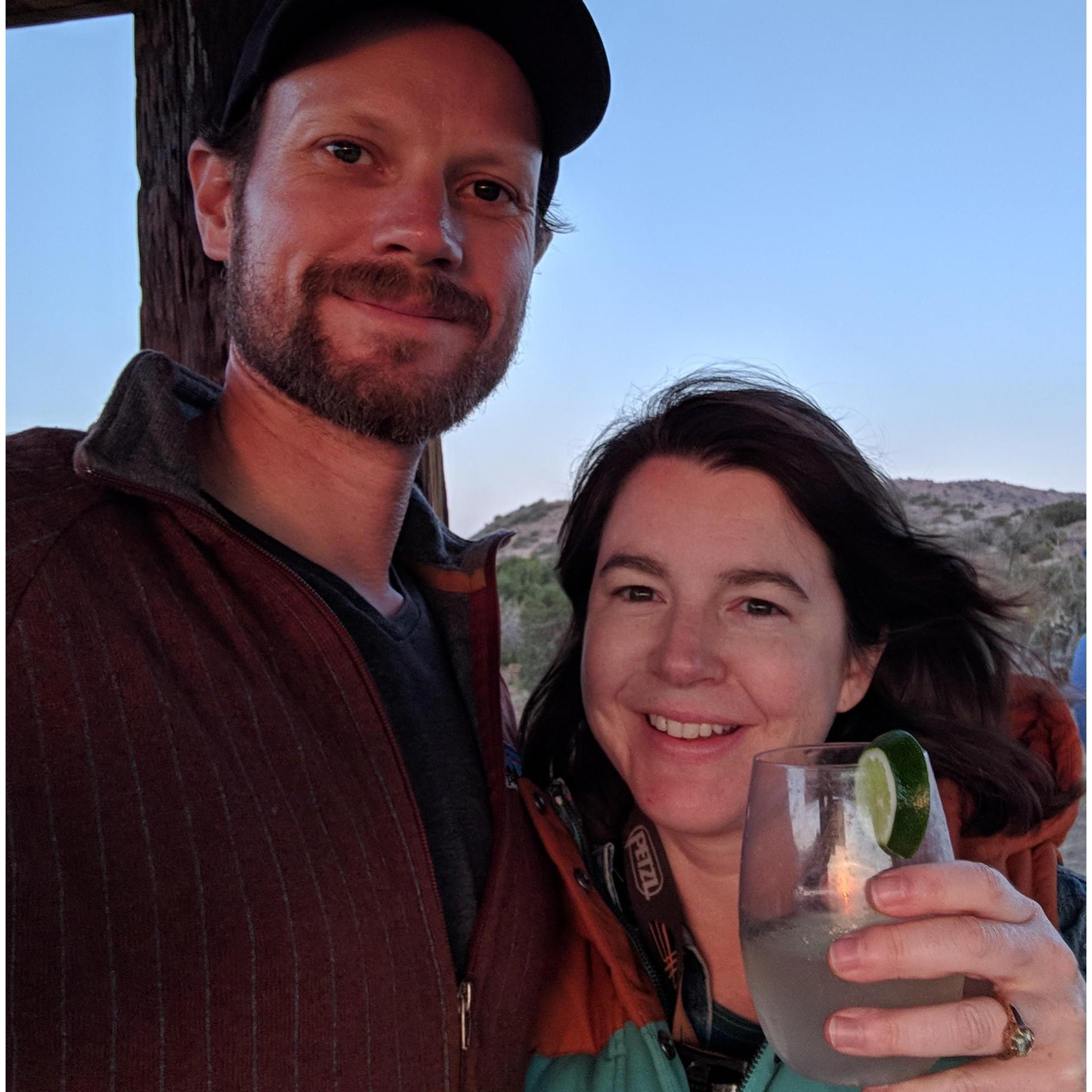 Toasting the sunset while camping with adventure friends in Cuyama, California