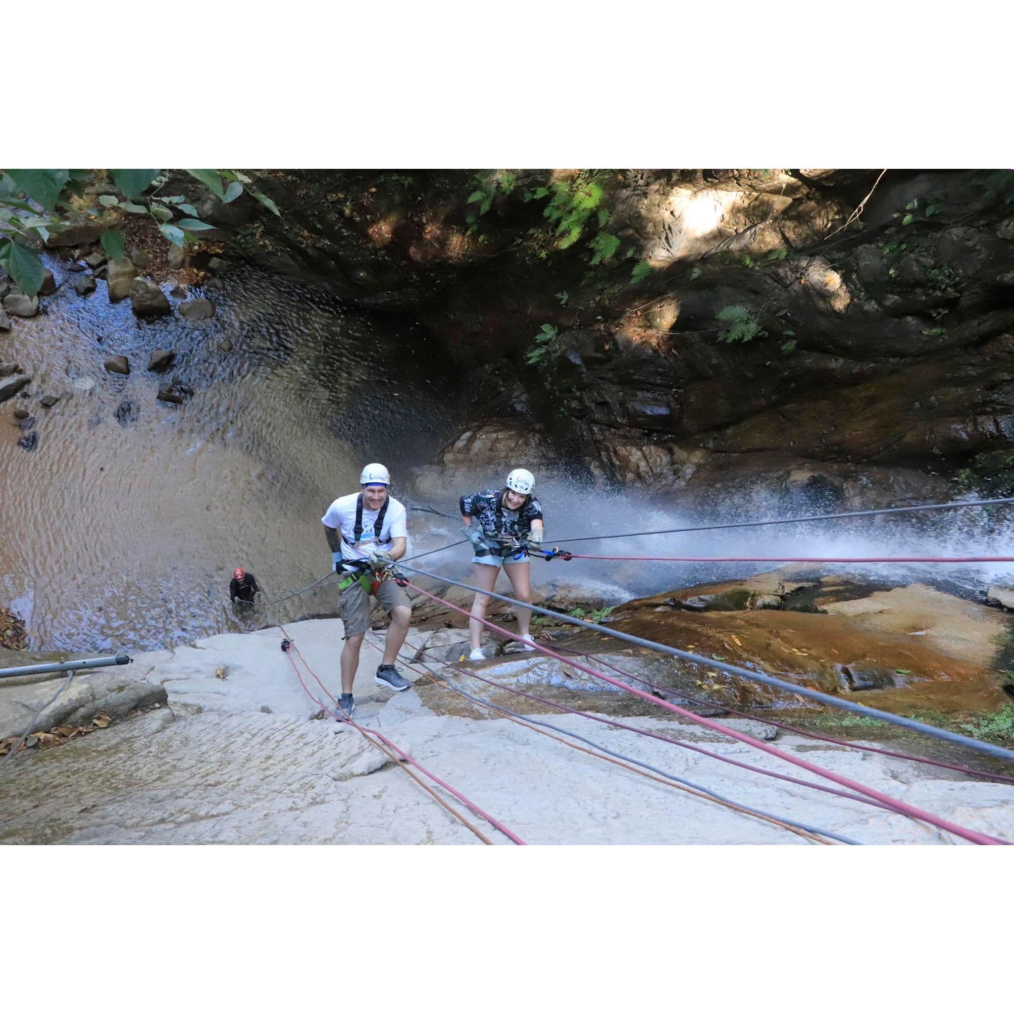 Repelling down a waterfall in Mexico together