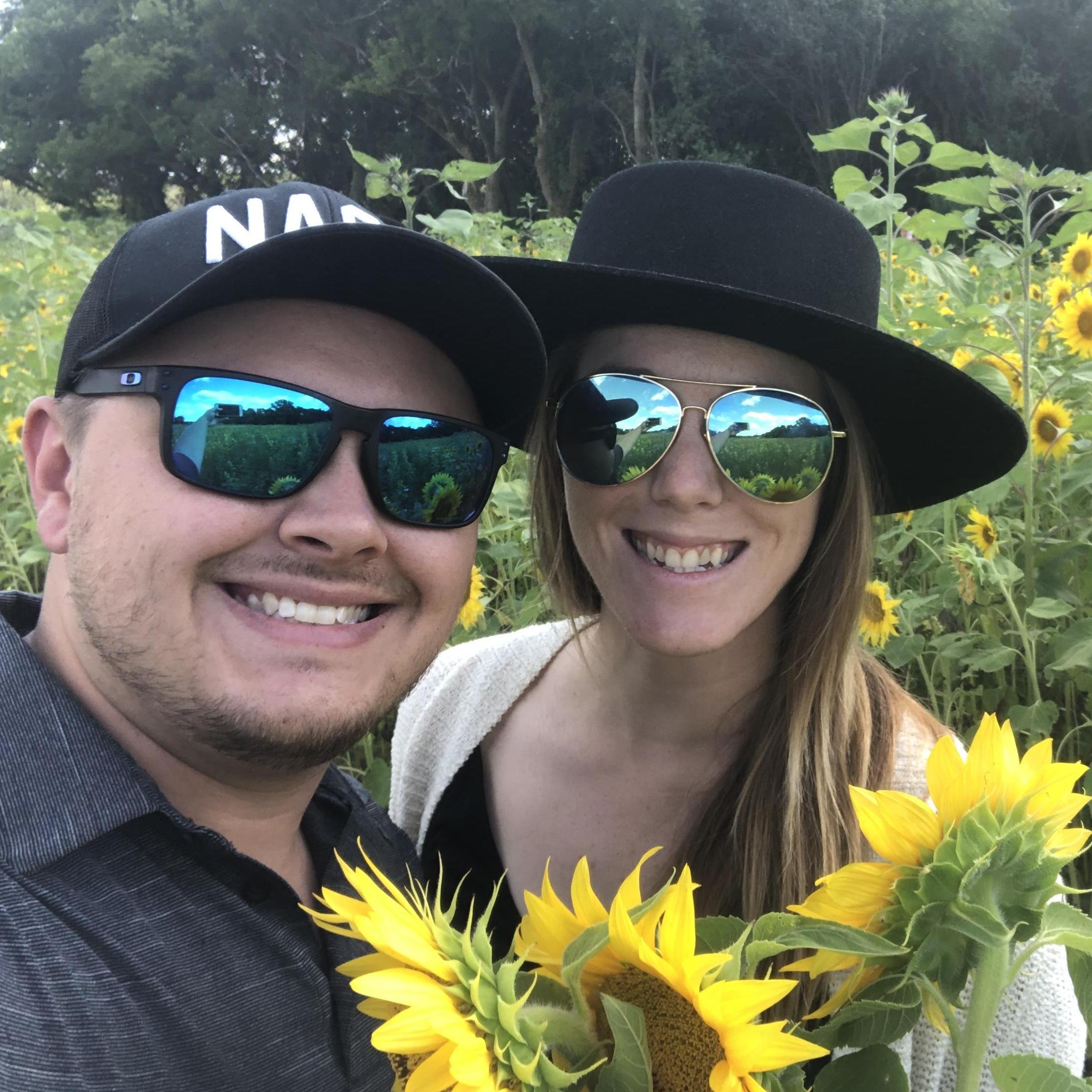 Adam and Shan "celebrated" 365 days until they say "I Do" at a sunflower field in Burlington, recommended by their photographer!