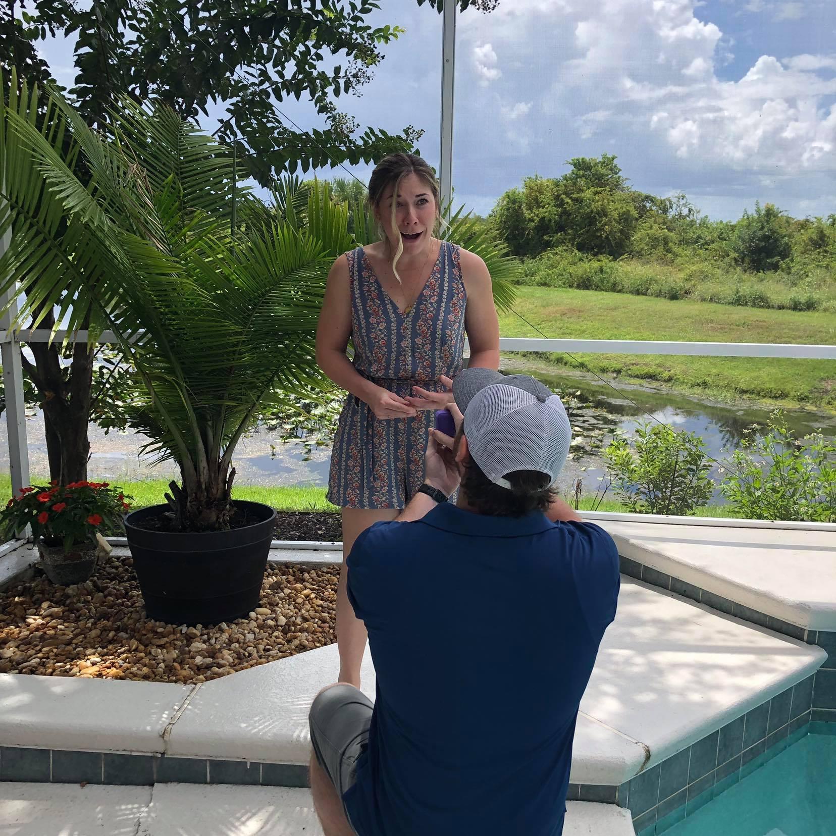 Colin surprised Michie on September 1, 2019. She had never been so happy/shocked before! He got her so good! Both of their entire family was there to witness despite a hurricane coming their way!