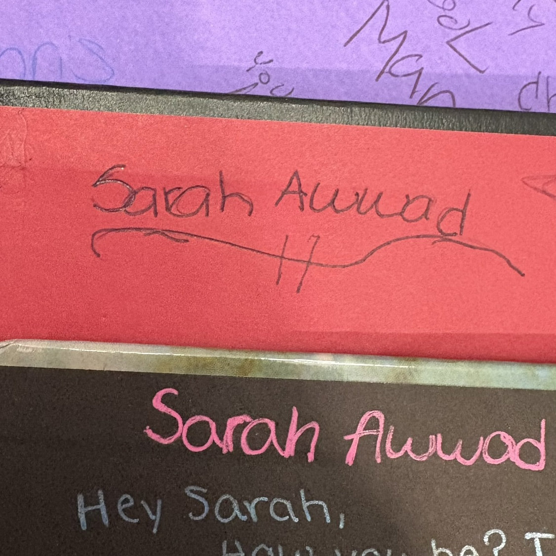 Chris’s yearbook that I signed in 1999 (purple) my yearbooks (2000 red and 2001 black)