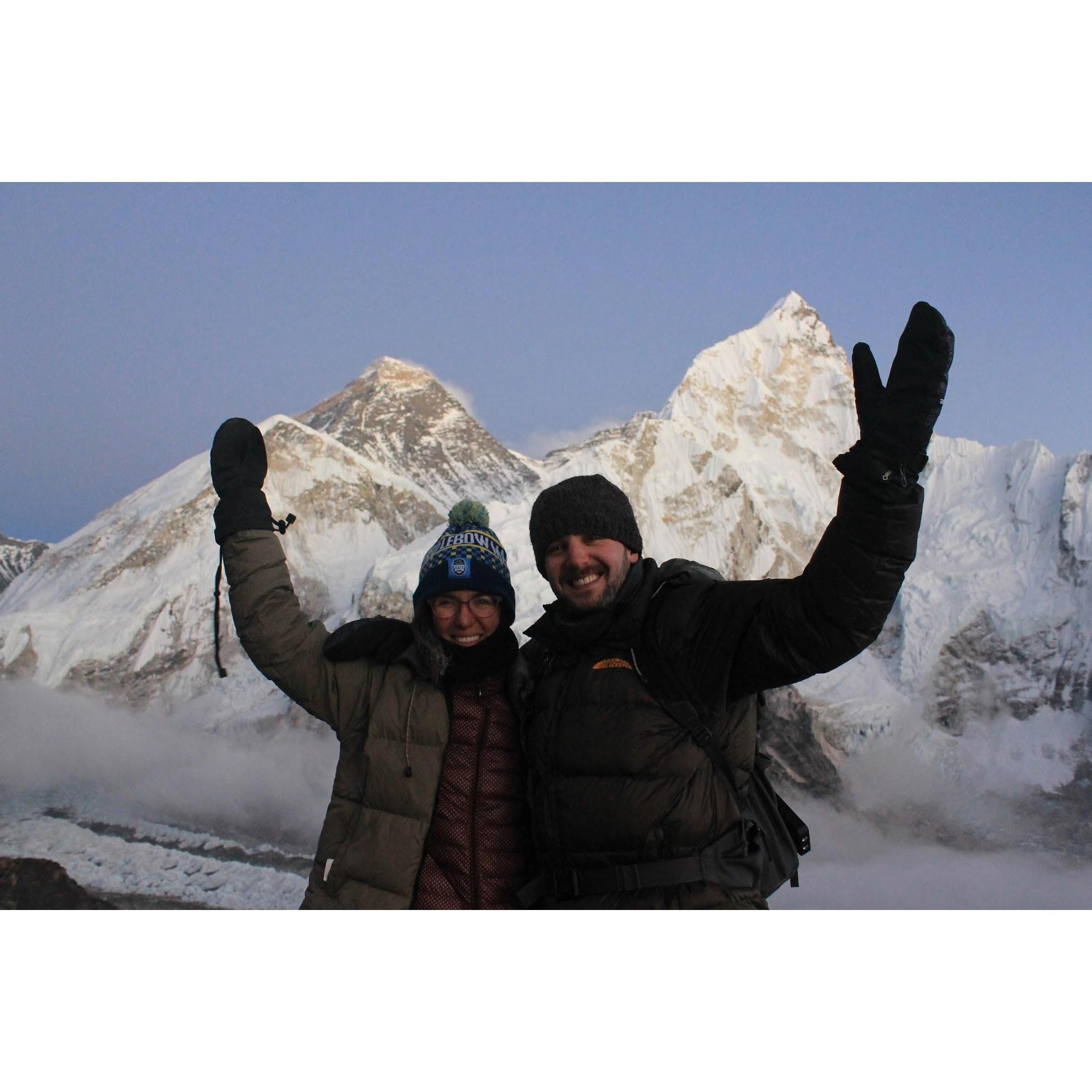 We made it to the top of Kala Patthar - the highest point we reached on our trek. The summit of Everest is behind us just over Erica's head.