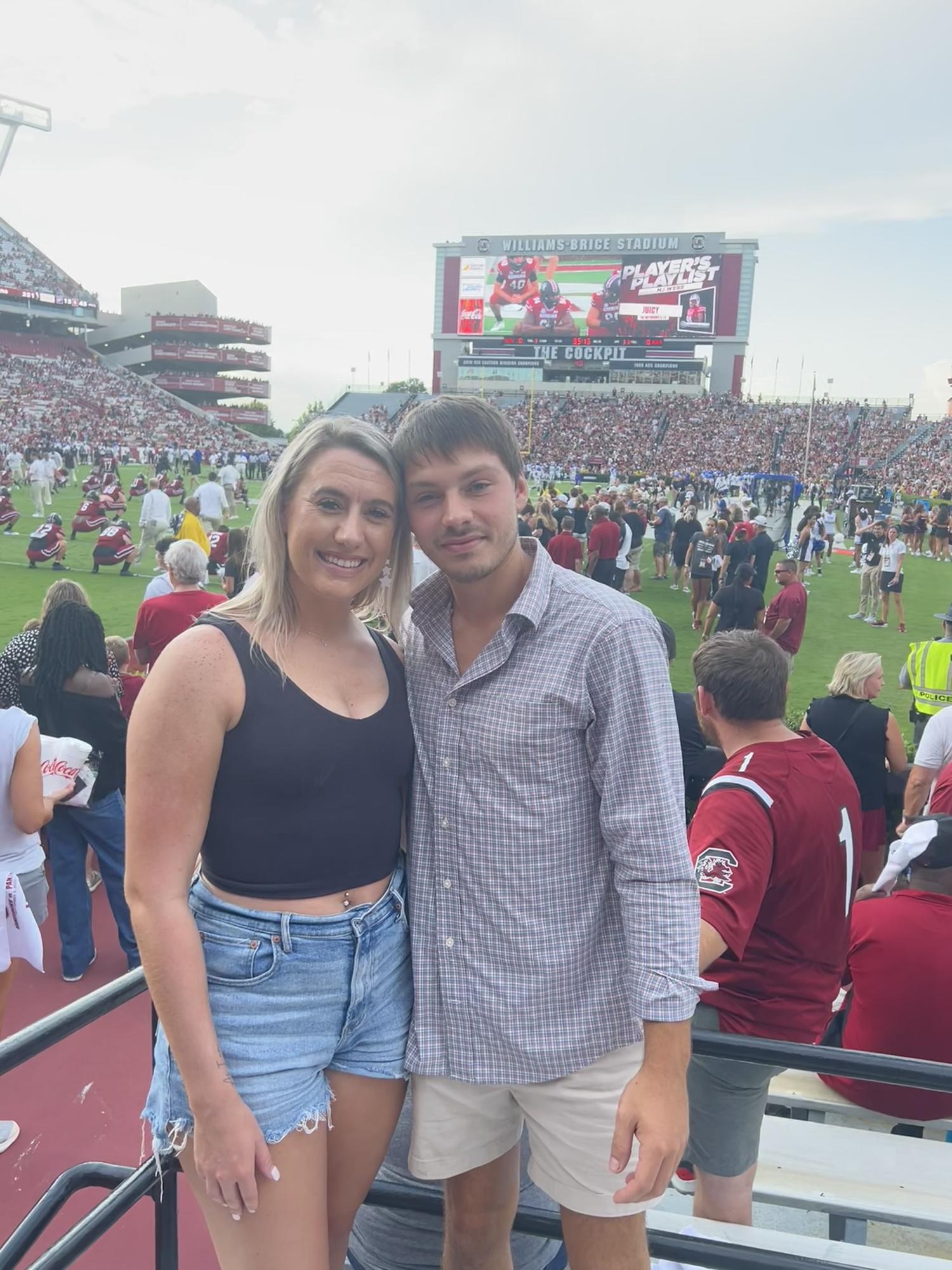 Took him to a football game! Fake smiles from him LoL