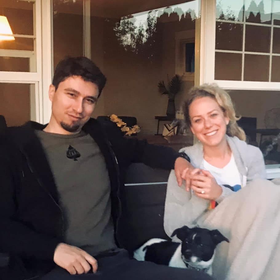 Swinging on the porch at our new home with Daisy