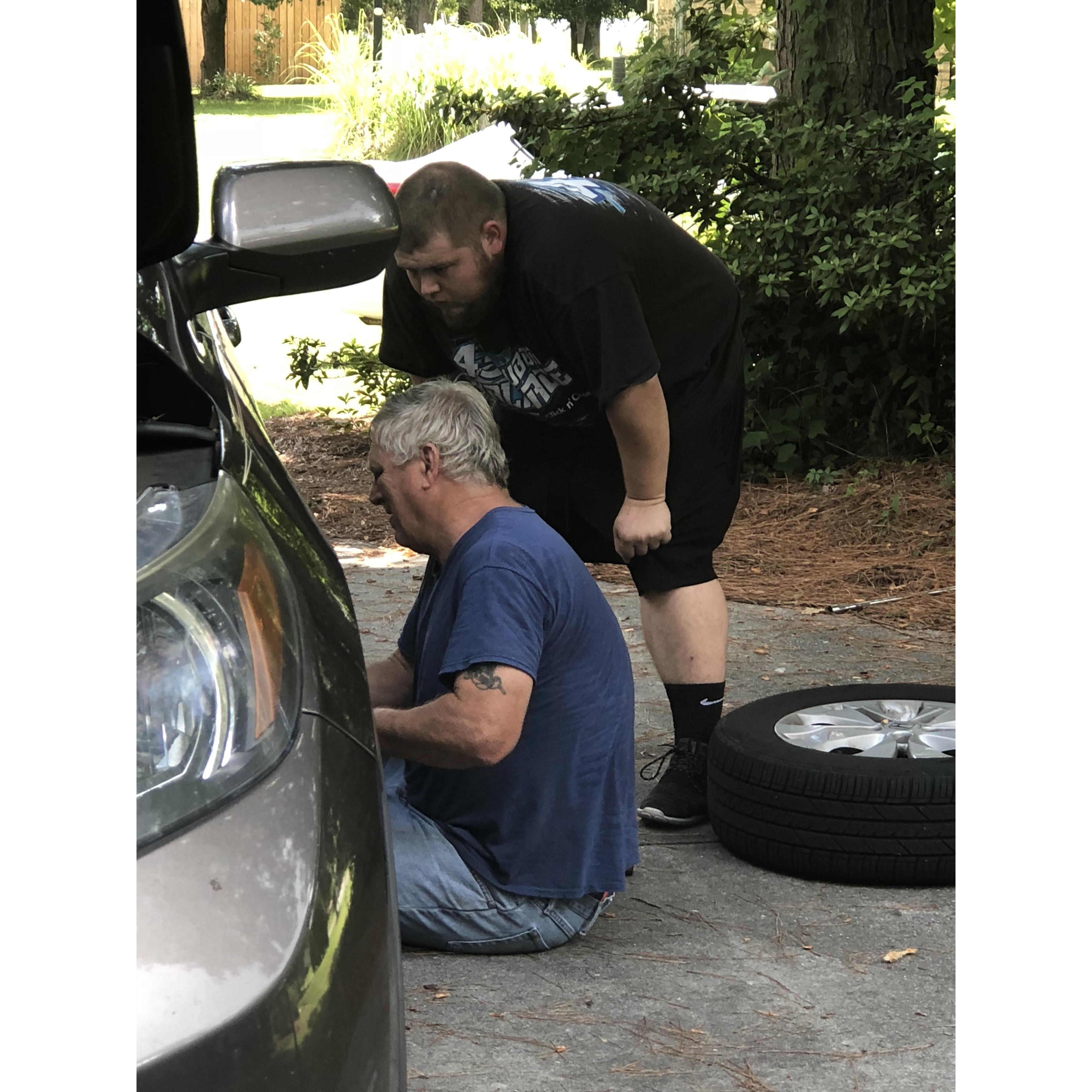 William and Dad working on the car