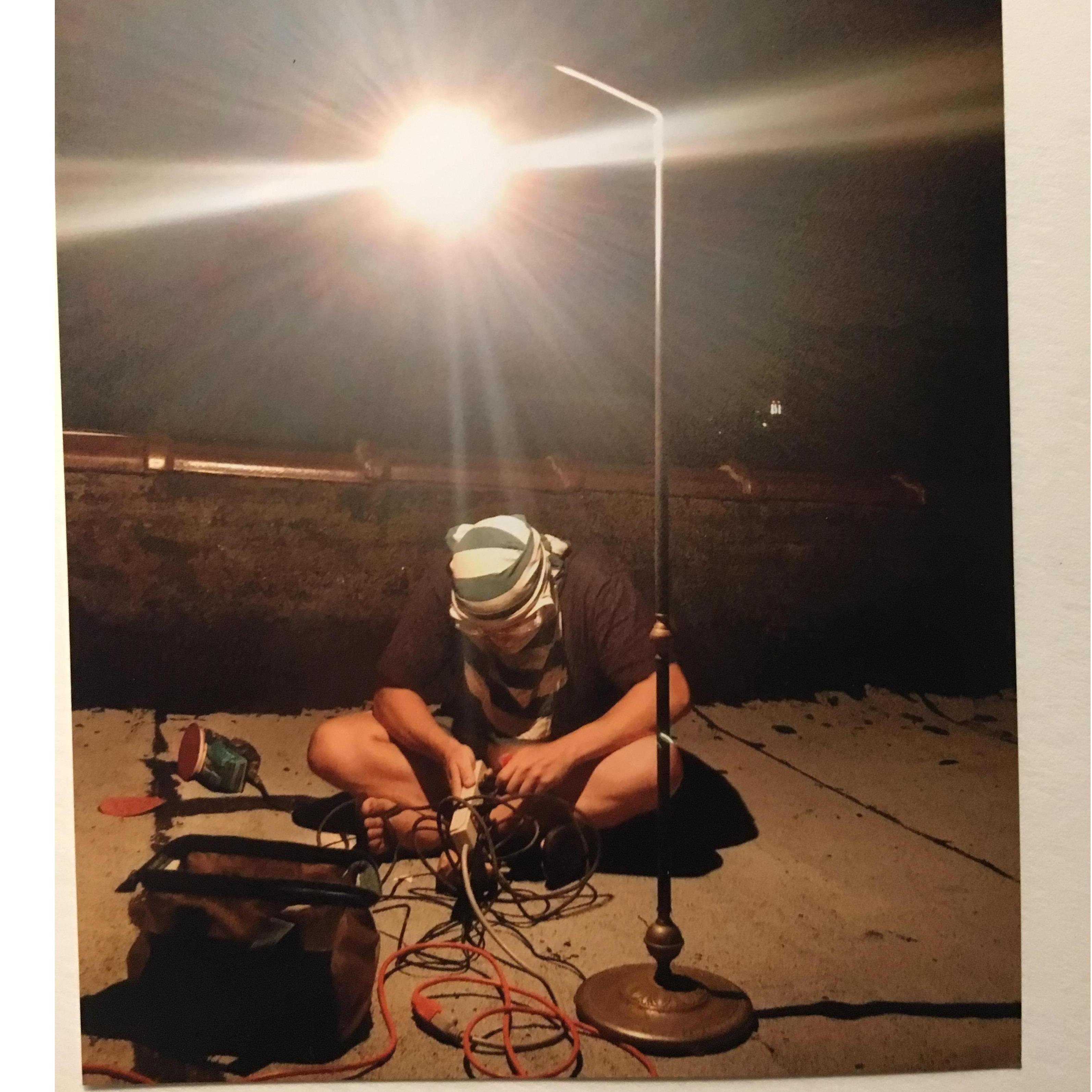 Corey wood-working on the roof. 
(Brooklyn, 2014)