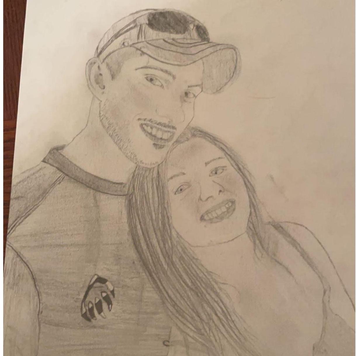 A drawing that I did of my favorite picture of Josh and I at the time, Josh shed a tear from it and it hangs on our fridge today!