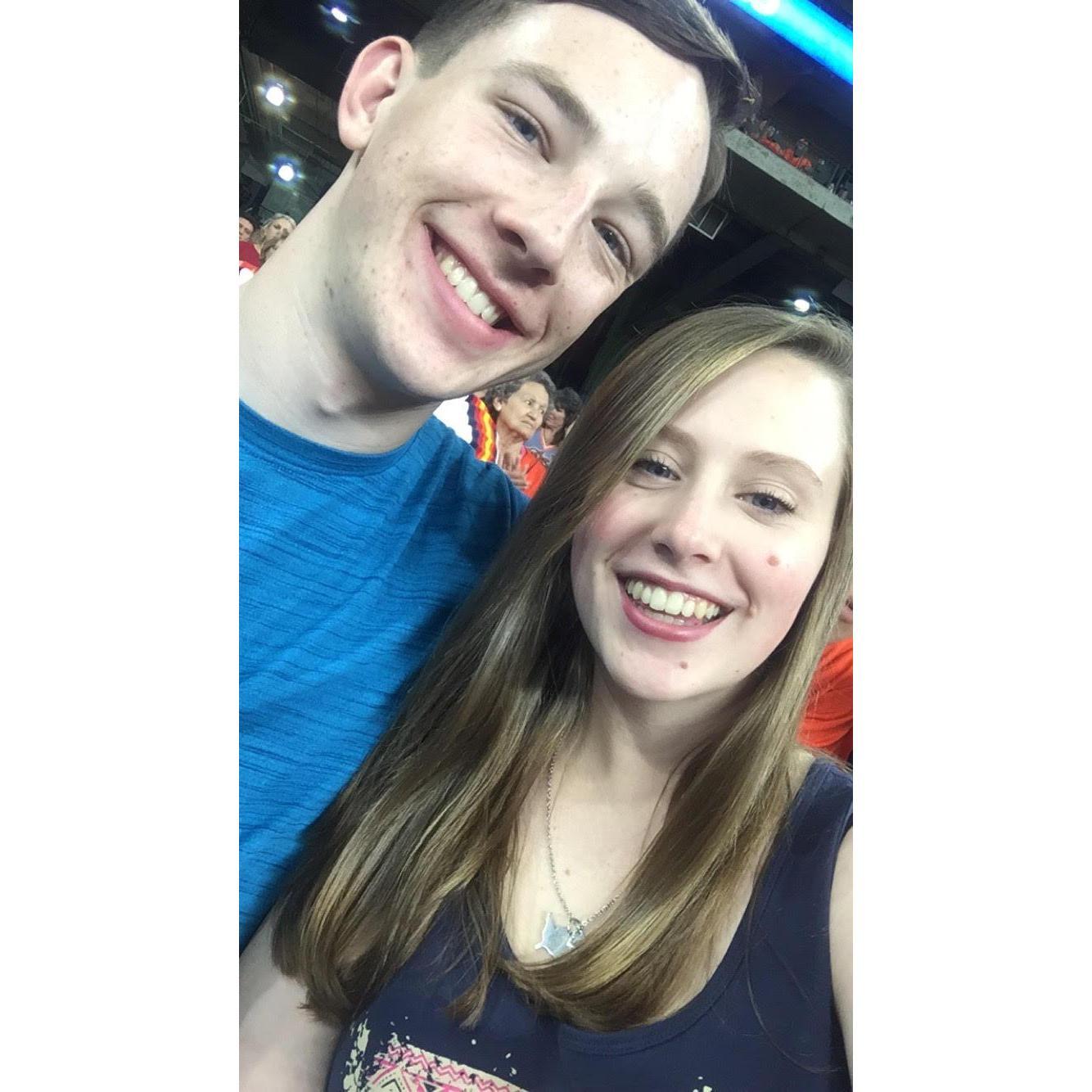 At an Astros game during a weekend visit while Morgan was interning at his uncle's engineering business in Houston while Emma stayed with her family in Arlington.