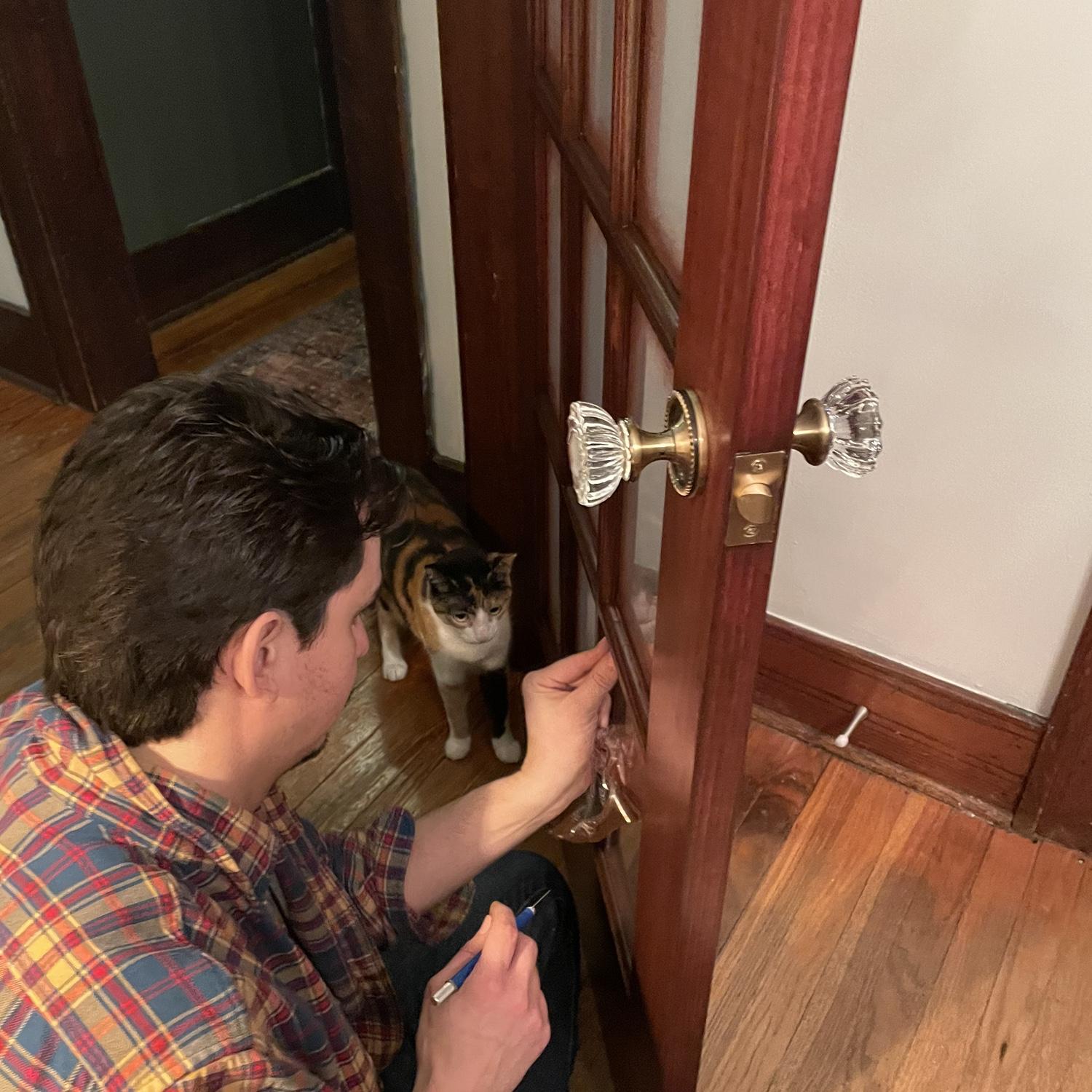 Cleo helping Dad put in the new vintage-inspired door.