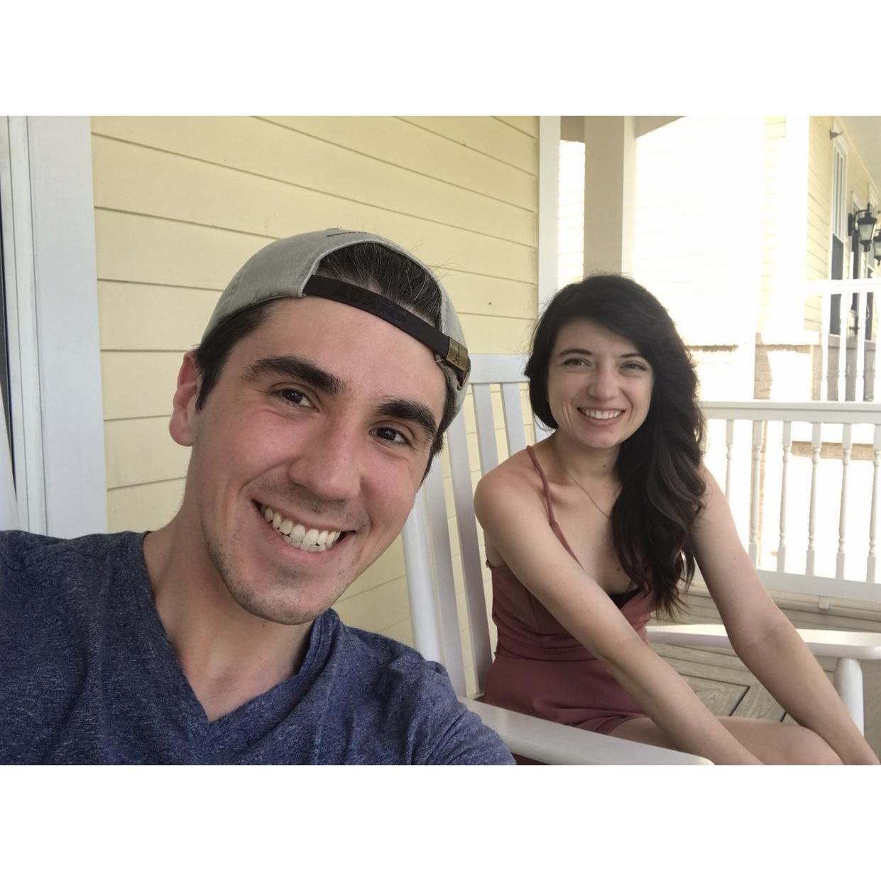 Enjoying the summer on a front porch in rocking chairs