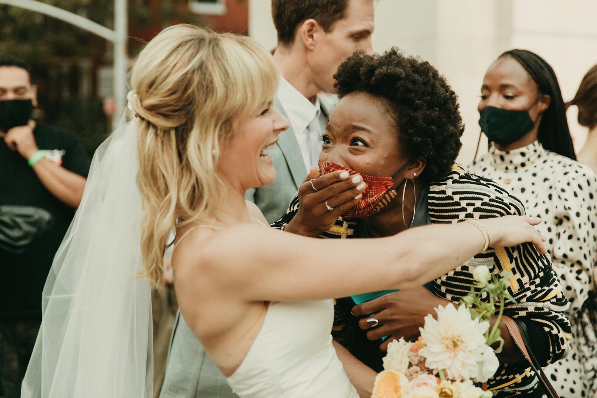 Rosebud & Aminah Imani, who is telling Rosebud her son declined the invitation to be ring bearer. Photo by @purroy_photo_video