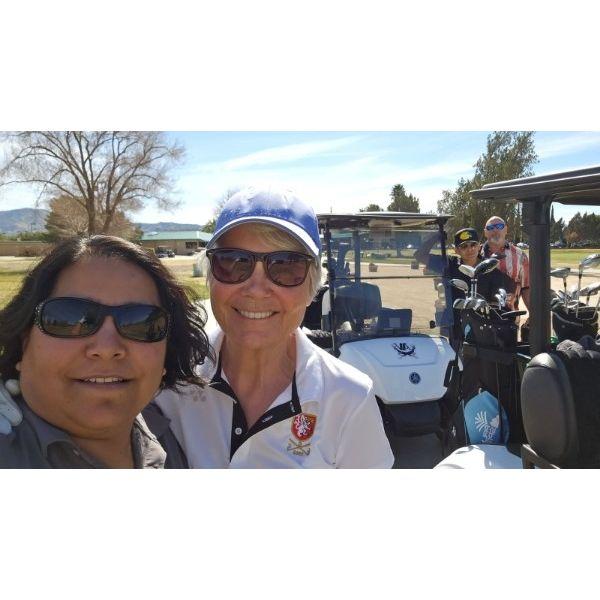 Anne and I playing golf with Steve and Preston.