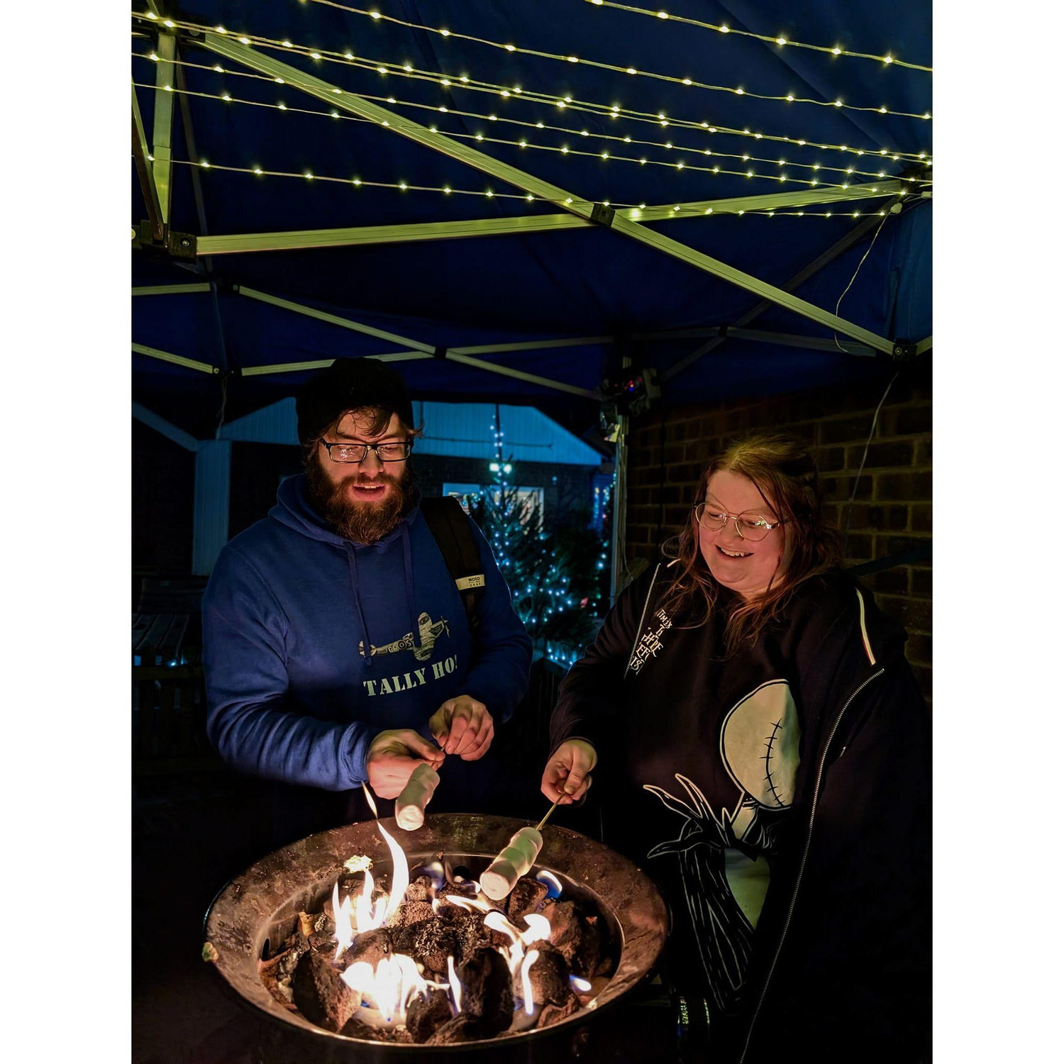 Tom trying to demonstrate the right way to toast marshmallows at light post farm over the christmas period.