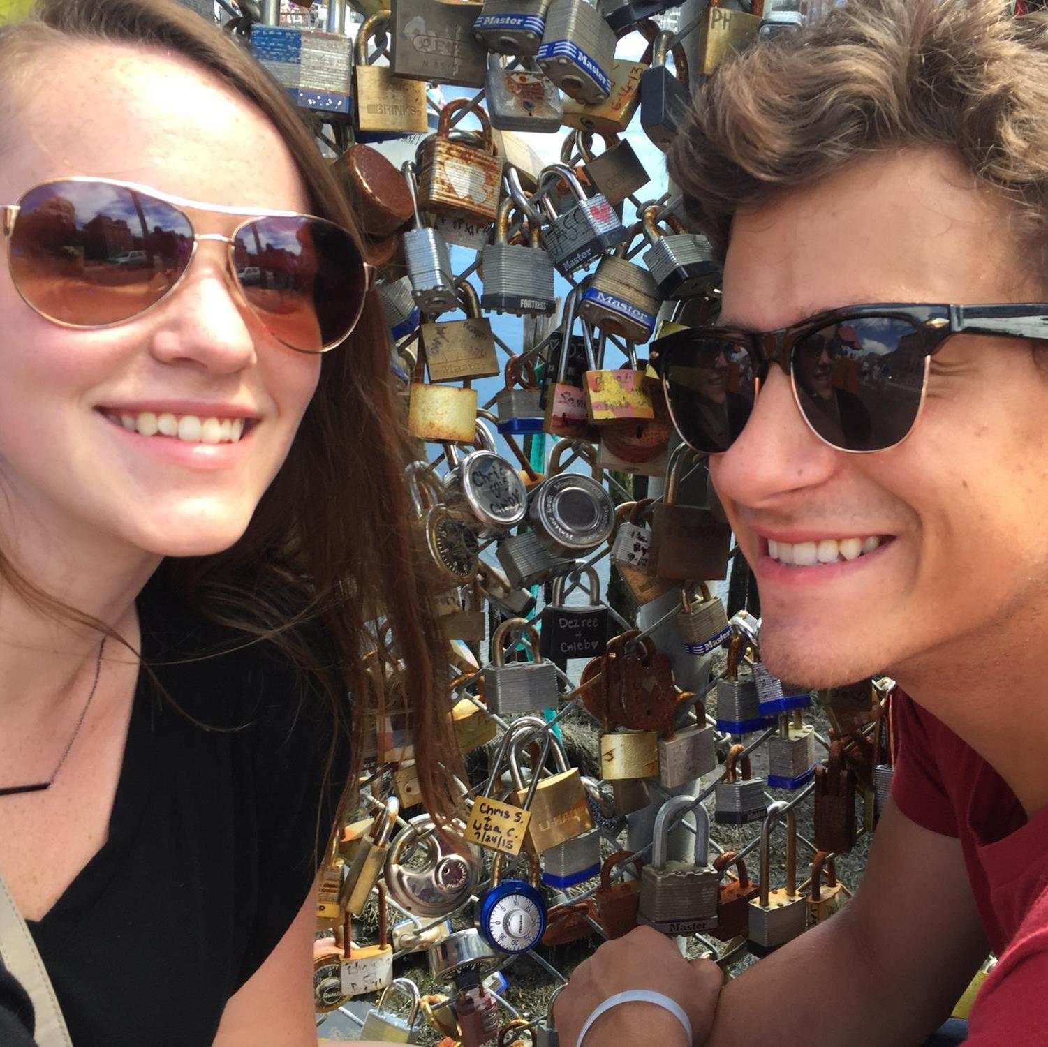 Putting our lock on the fence in Maine that was one of the only sections that survived when the weight took it down!