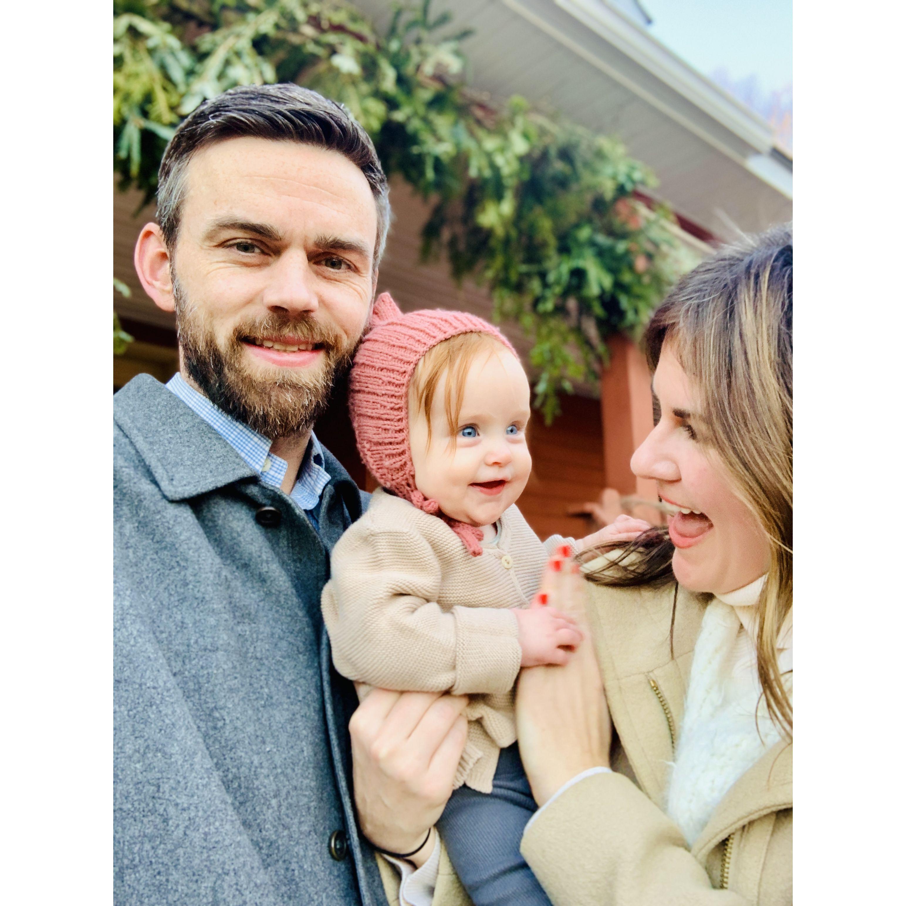 Holiday photos in front of our house December 2023. Ember's pink hat was knit by dear friend Cybelle!