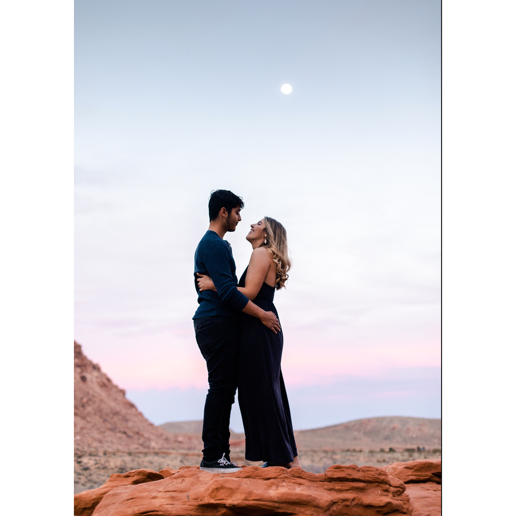 A beautiful snap from our engagement photos getting ready for the wedding !