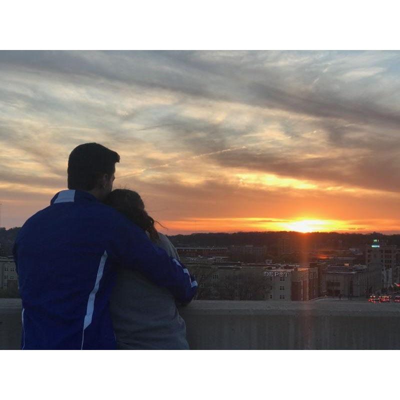 Our second date. A stranger asked if we wanted a photo with the sunset on the roof of the UA parking deck - April 2017