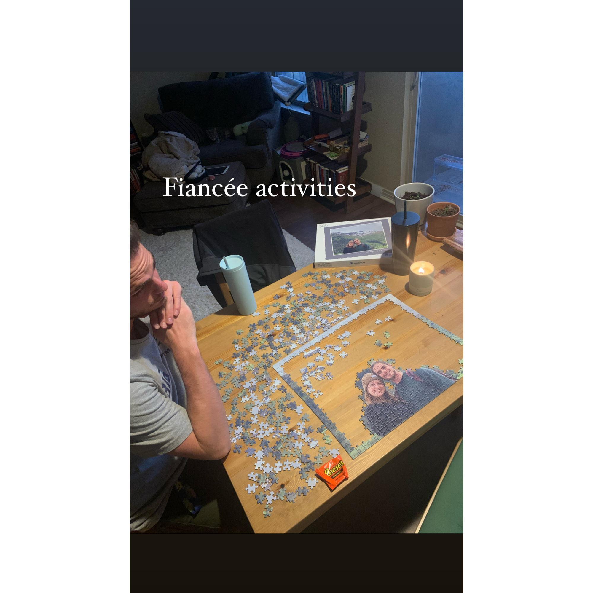 Putting together a puzzle of a photo from our Alaskan cruise. Jason pretending to help.