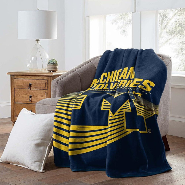 Michigan Wolverines 60" x 80" NCAA Officially Licensed Fleece Blanket – Oversized Ultra-Soft Bed or Couch Blanket for Dorms, TV Nights, Tailgating & College Fan Gifts