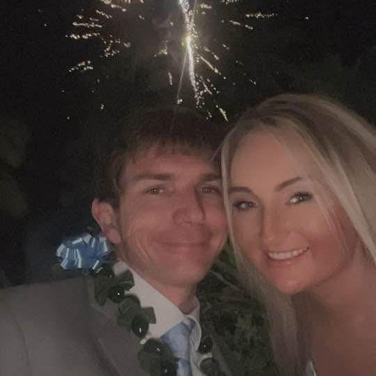 In Hawaii, after I could the bouquet and he knew he was stuck with me.