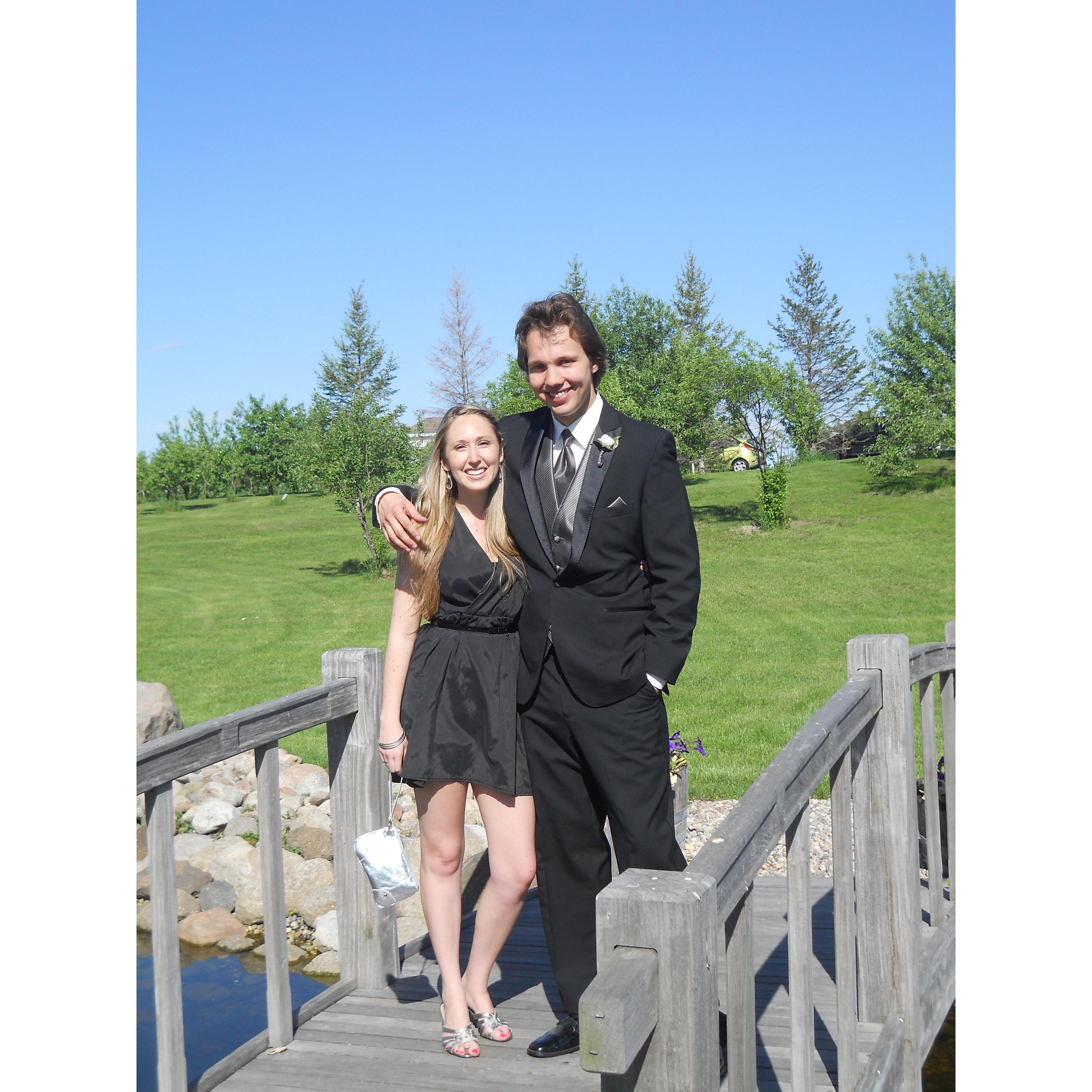 Young and in love standing on a walking bridge at Brauch and Maha's wedding in 2013.
