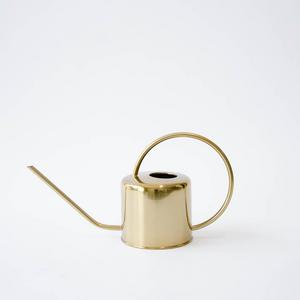 brass watering can