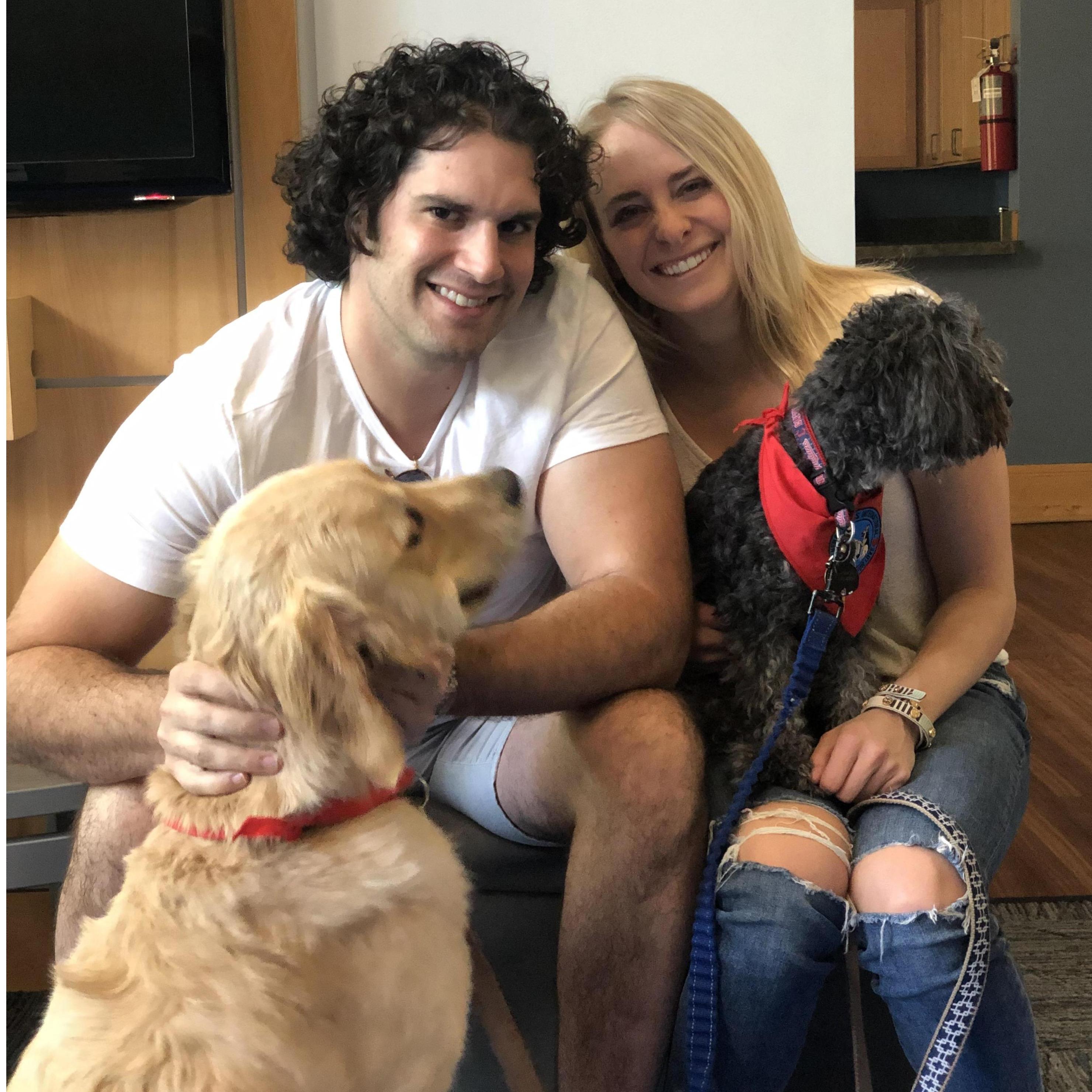 Proud parents at a therapy dog event