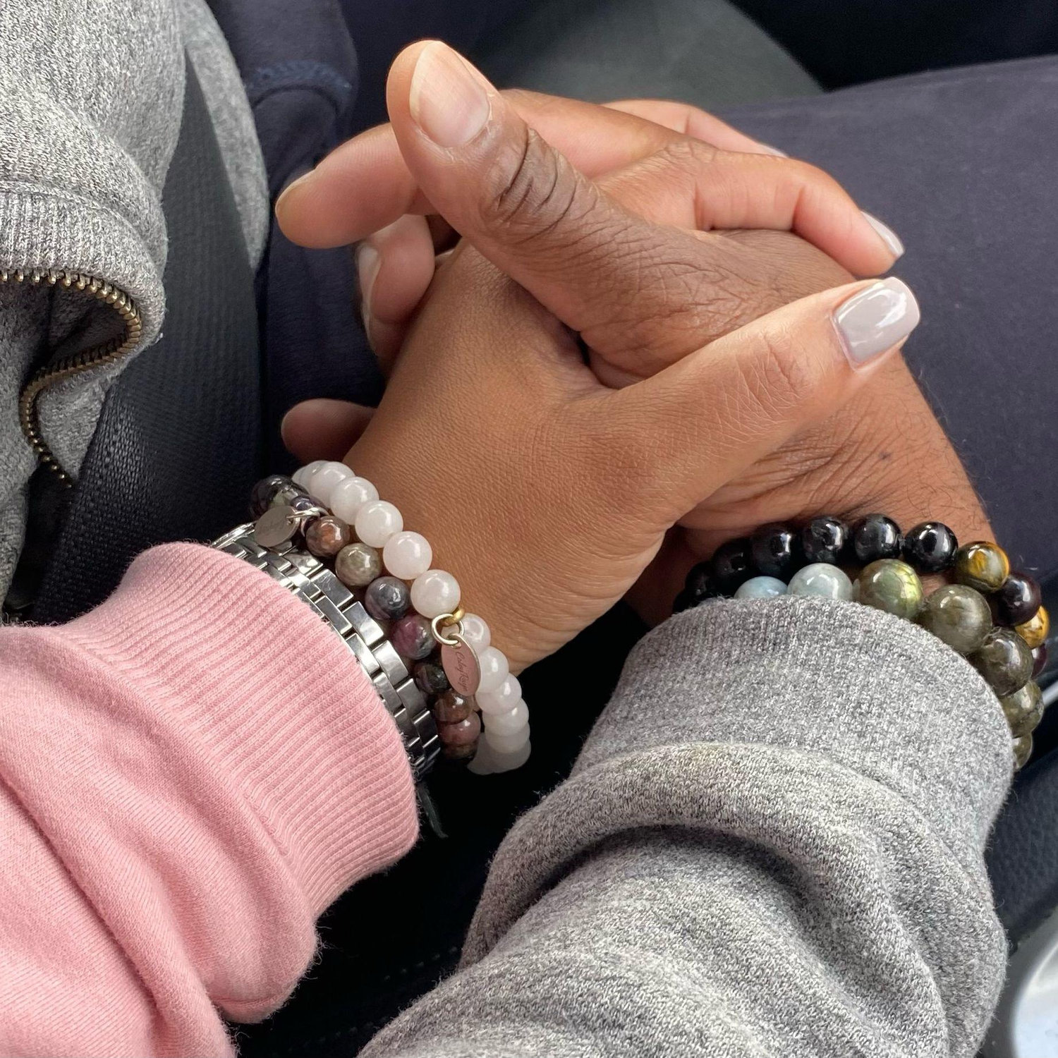 We both wear gemstone beads. Little did Greg know that he would meet a woman who makes bracelets. We are recently dating in this picture, so he is wearing store bought.