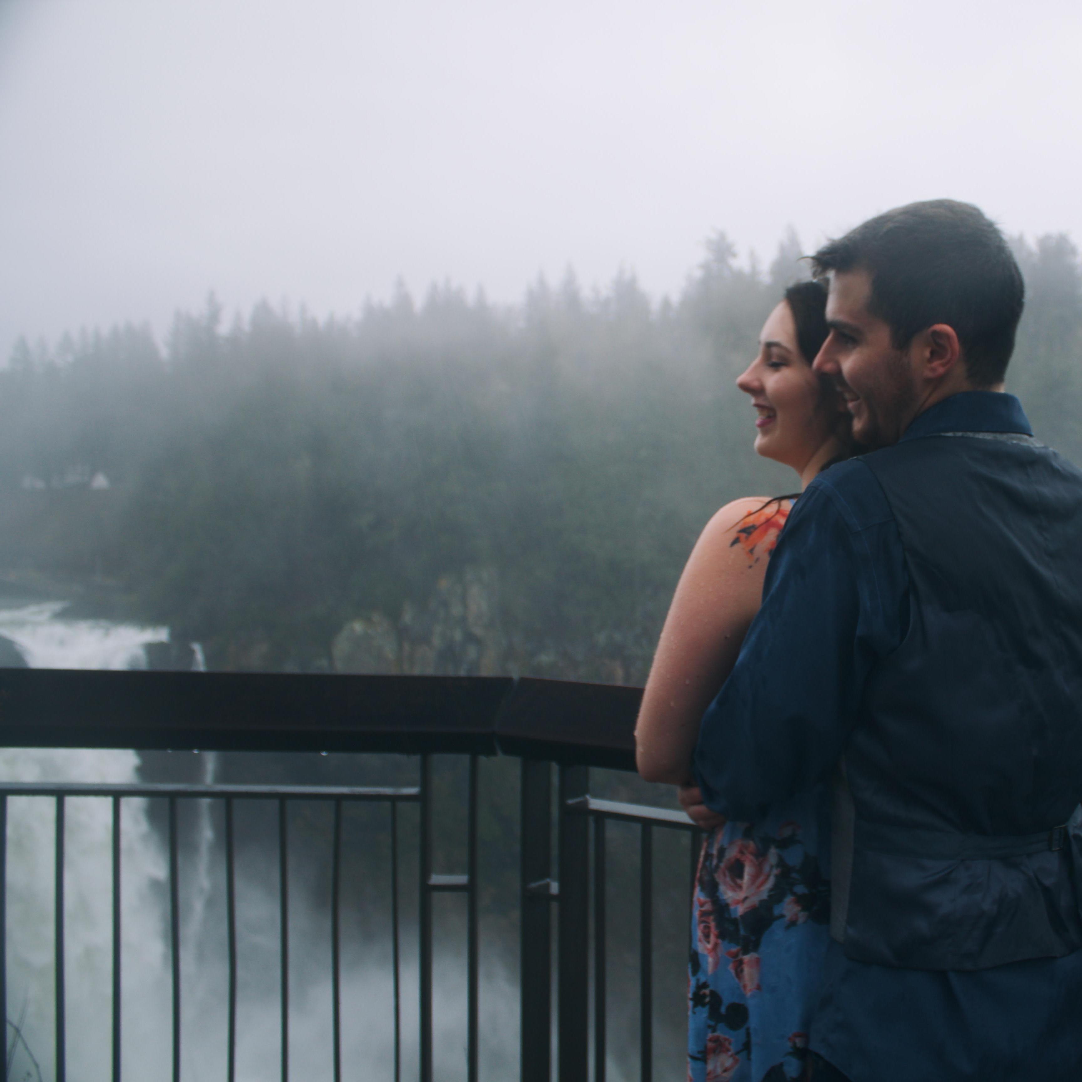 Us laughing during our engagement shoot because it was 40 degrees and raining. We were drenched before one shot was taken!