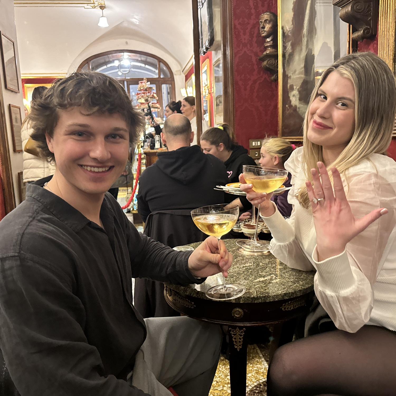 Celebrating our engagement in Rome with some champagne
