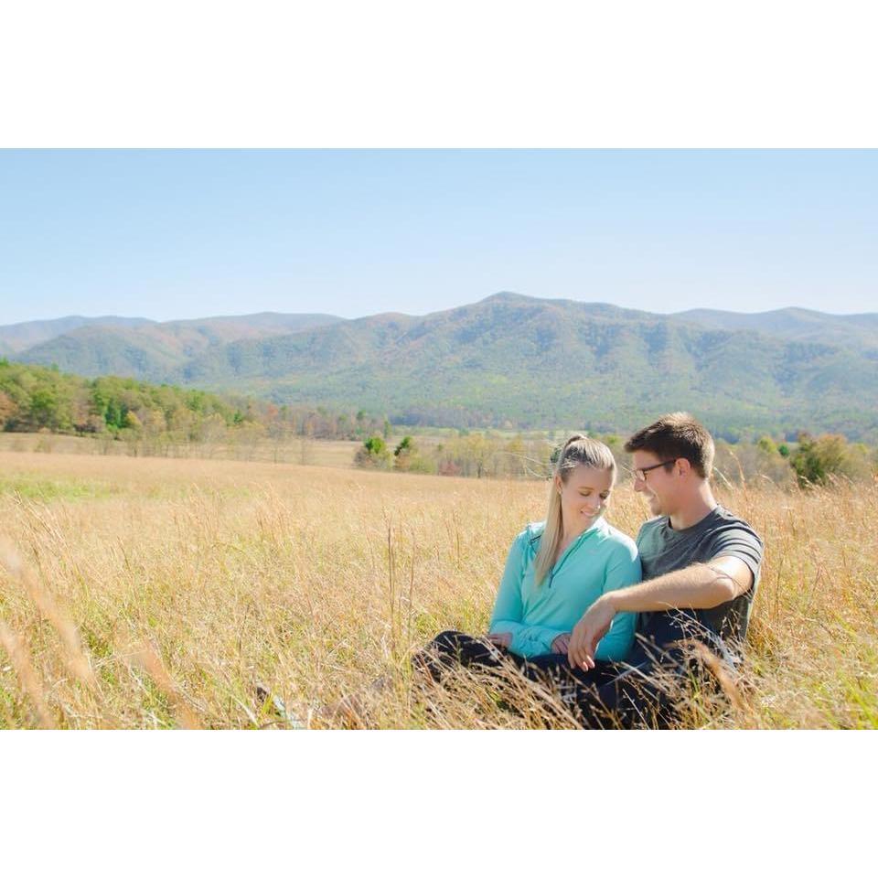 Cade's Cove within Smoky Mountain National Park. Fun fact: I fell and rolled my ankle as we walked into this valley to take photos and couldn't walk. Hence why we are seated!