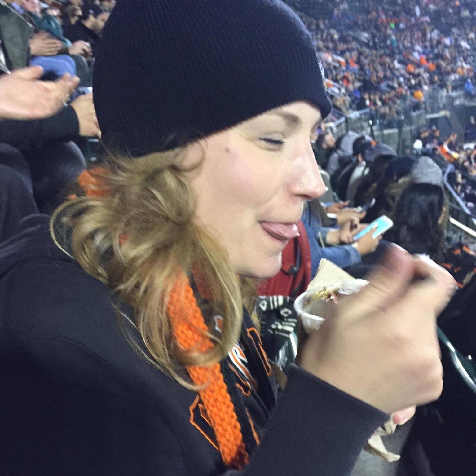 Jillian and her ice cream at one of their first dates cheering on the Giants.