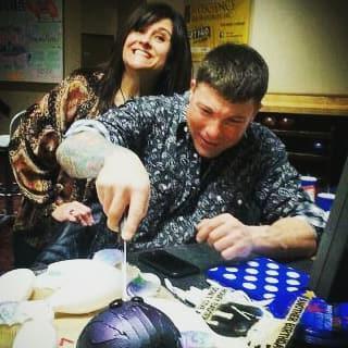Cutting into his honey badger cake...if you know Adams, you know this is the perfect nickname for him. (YouTube a honey badger video)