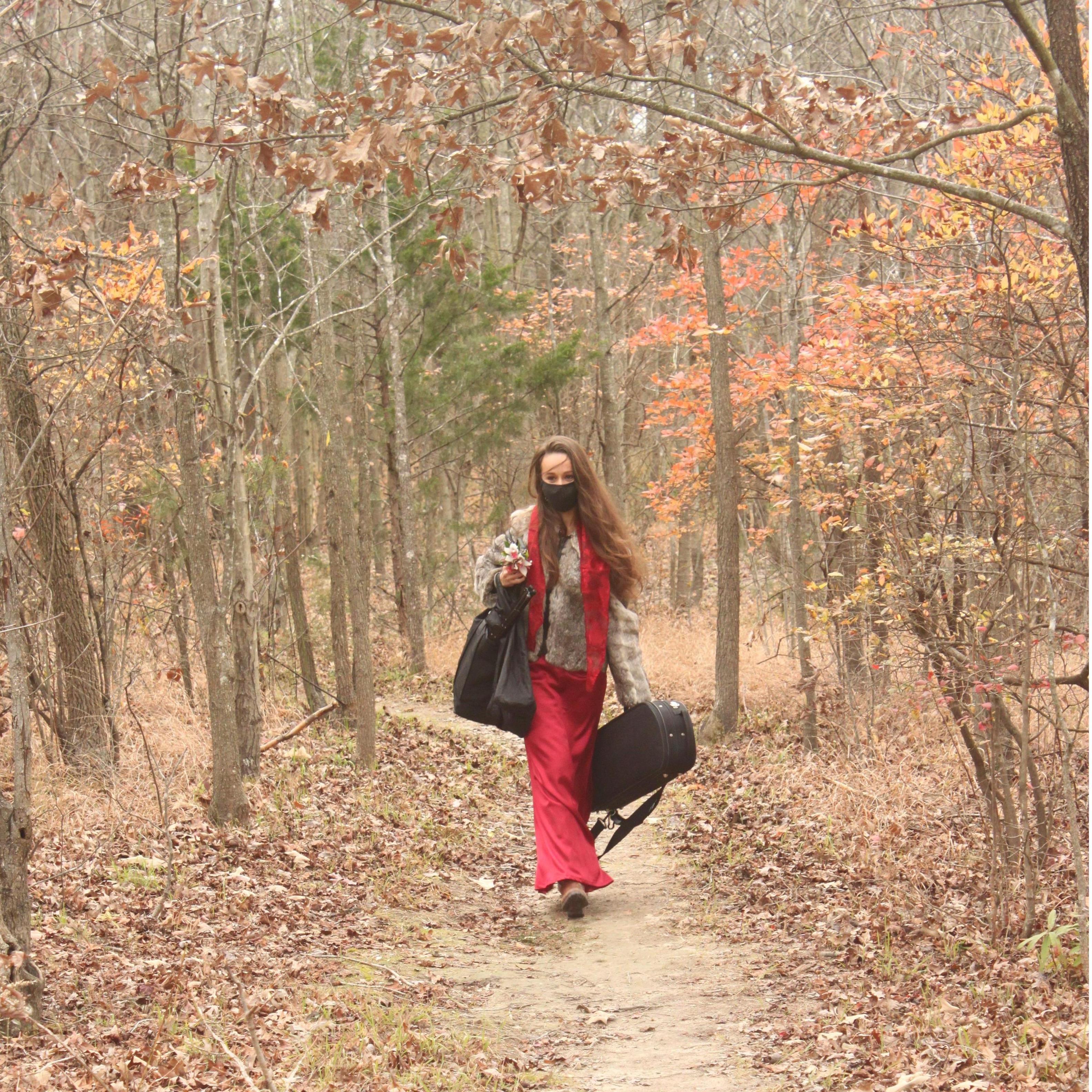 Our wonderful sister (and soon to be sister-in-law) walking down the trail before opening up her violin to play our processional and later the recessional!