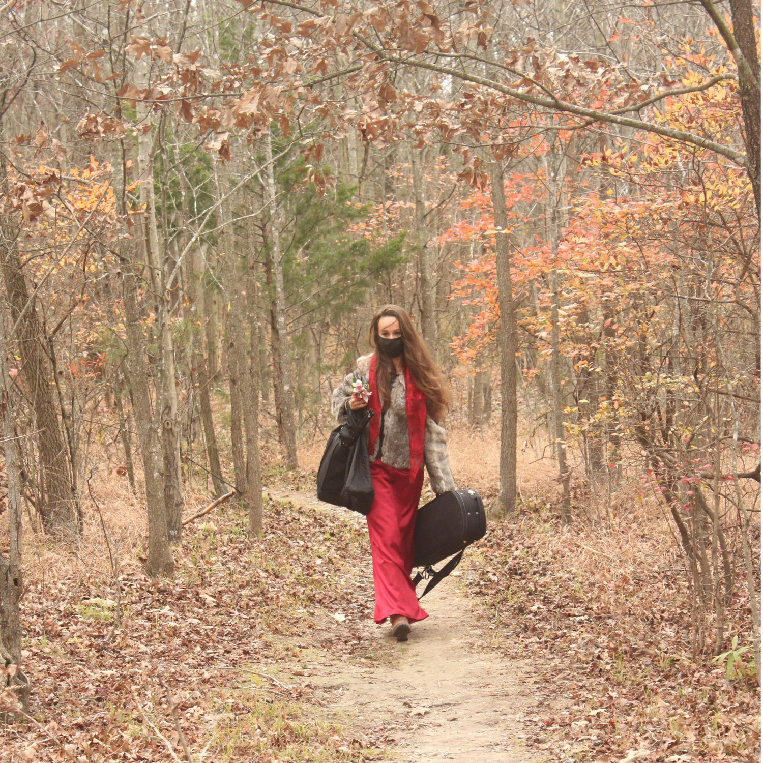 Our wonderful sister (and soon to be sister-in-law) walking down the trail before opening up her violin to play our processional and later the recessional!