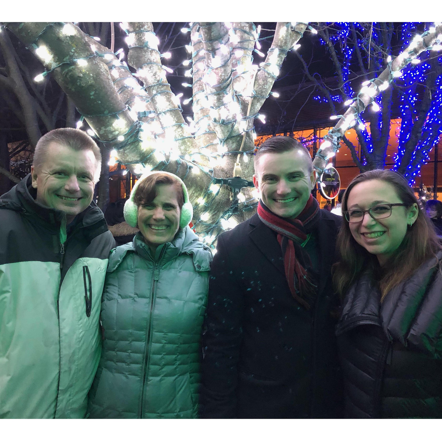 Enjoying a night out with my parents, marveling at the holiday lights.