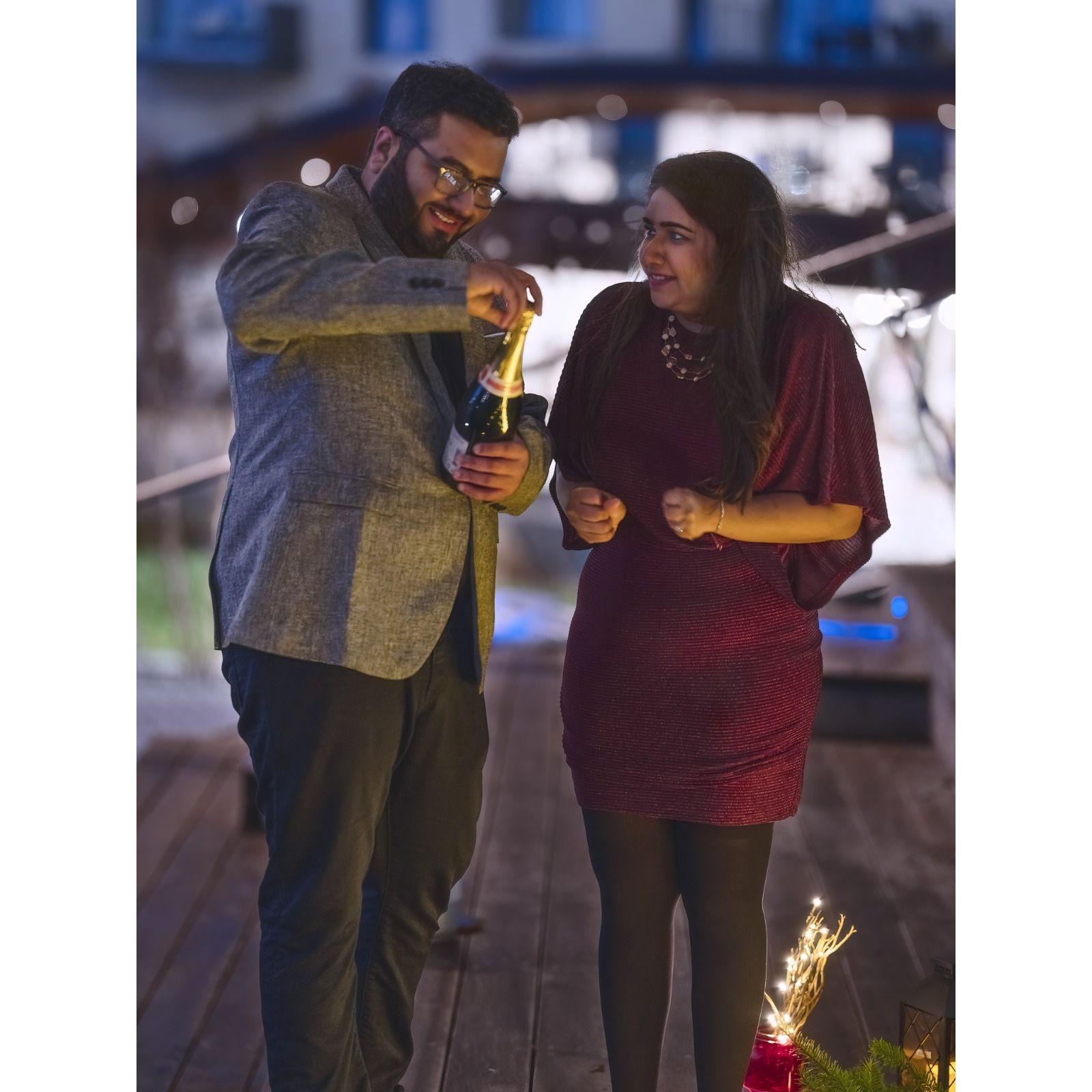 The one that truly depicts the reality of our lives - Pranay patiently opening the champagne while Rushina waits impatiently